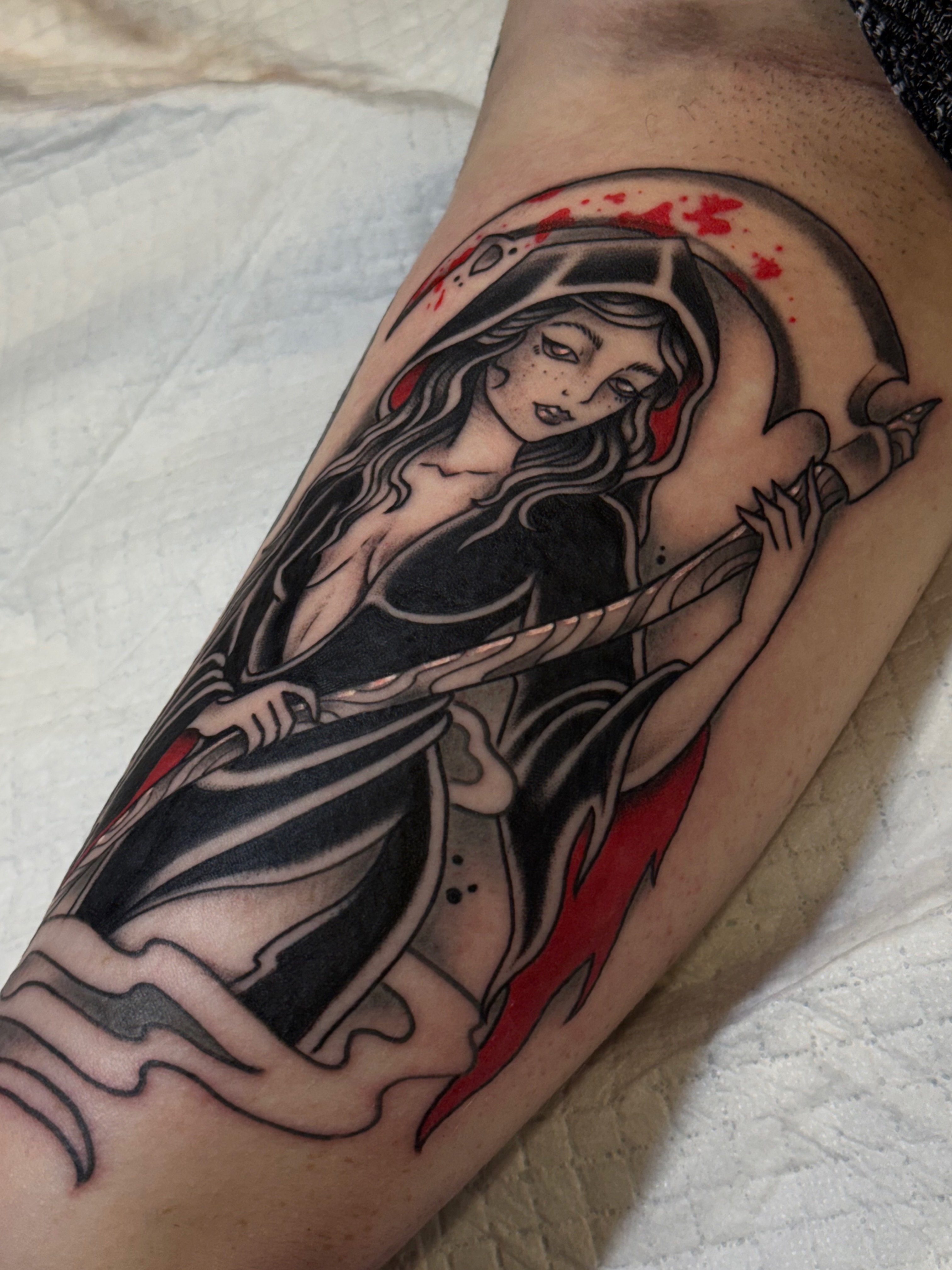 Woman with scythe American traditional tattoo on the forearm by Chelsea Graham, Seattle, Washington
