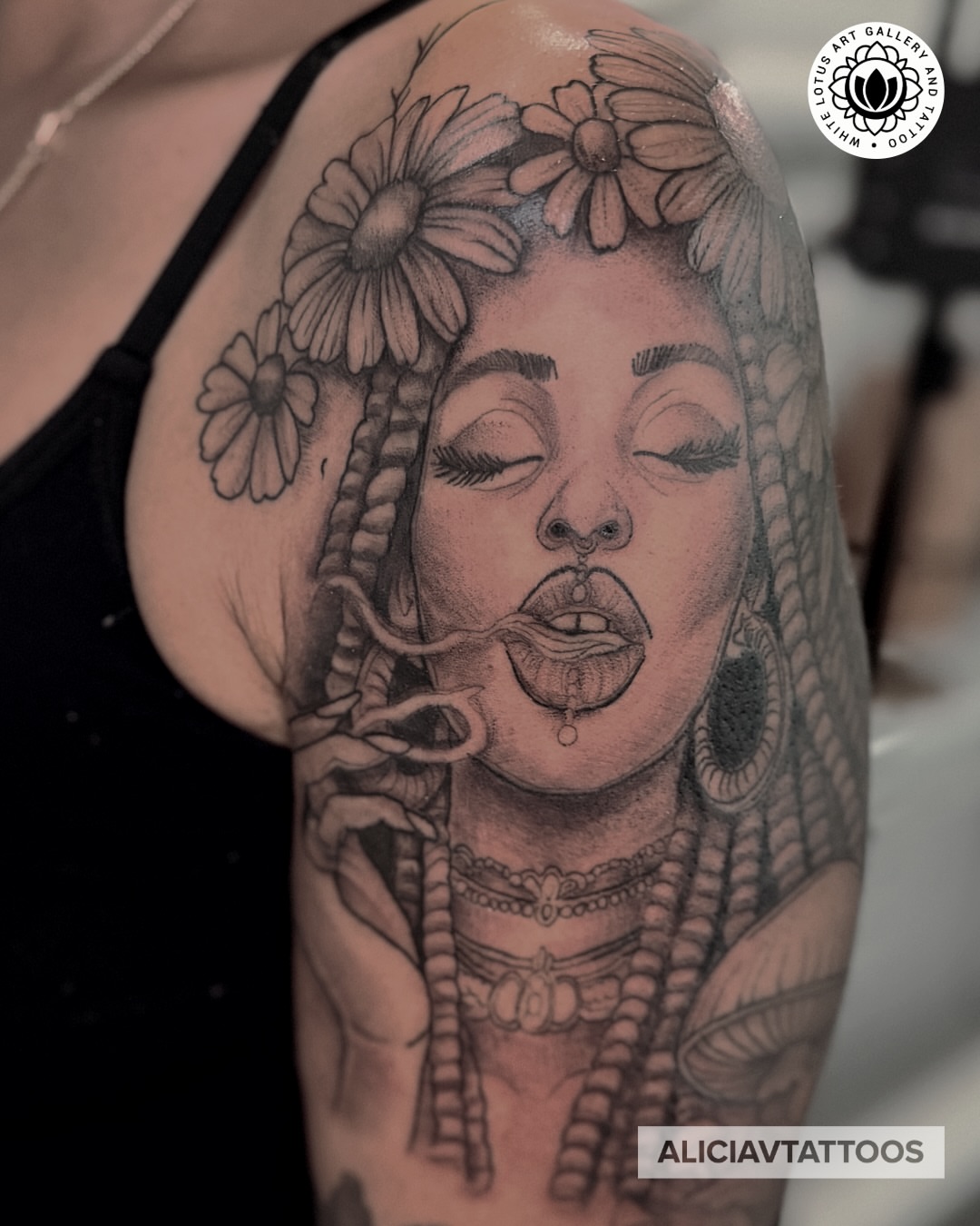 Woman with flowers realism tattoo on the shoulder by Alicia Vasquez