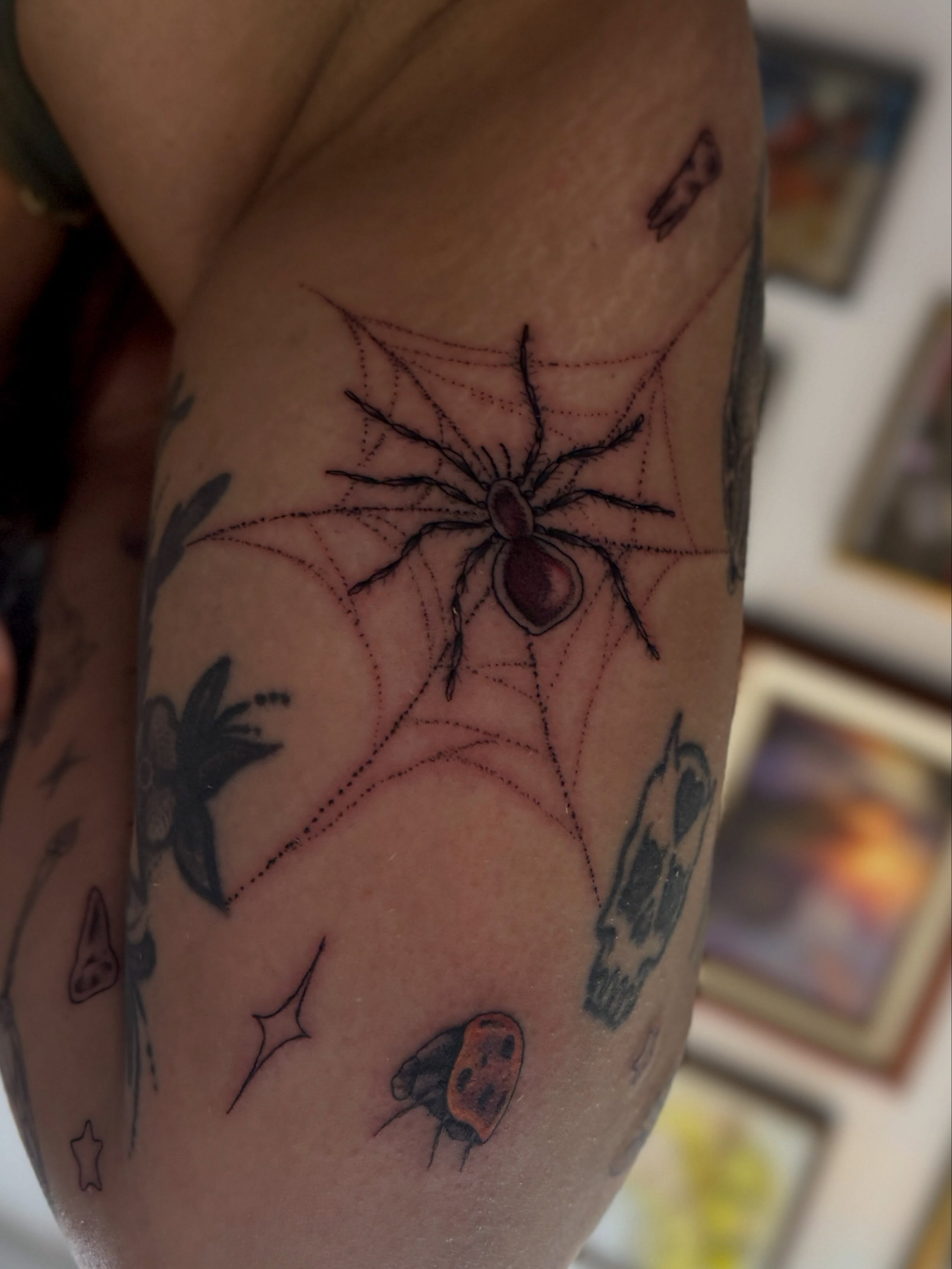 Spider web dotwork tattoo on the forearm by Kamakana Pankiwska