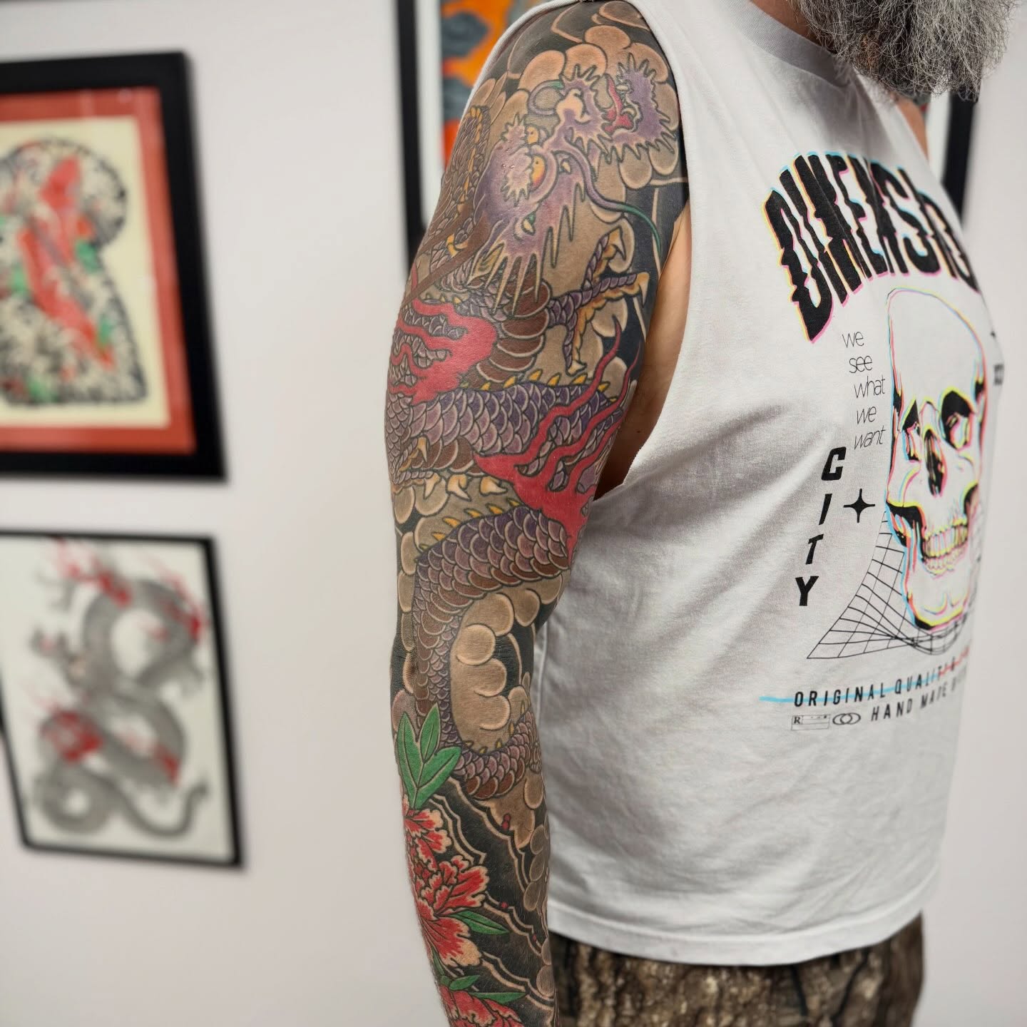 Dragon and floral japanese irezumi tattoo on the upper arm by Jason Eisenberg