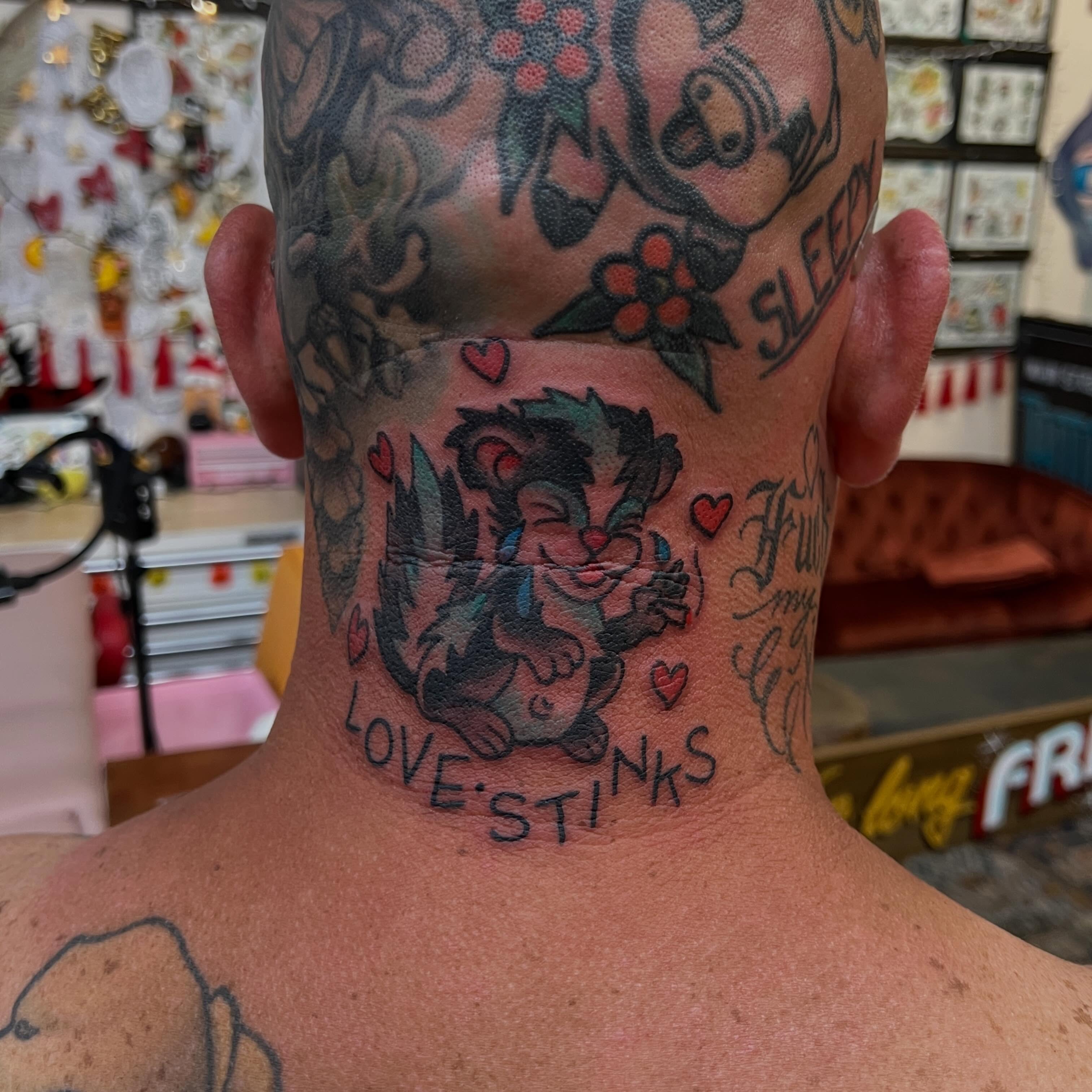 Cat with hearts American traditional tattoo on the neck by Mat Helton, Fairborn, Ohio