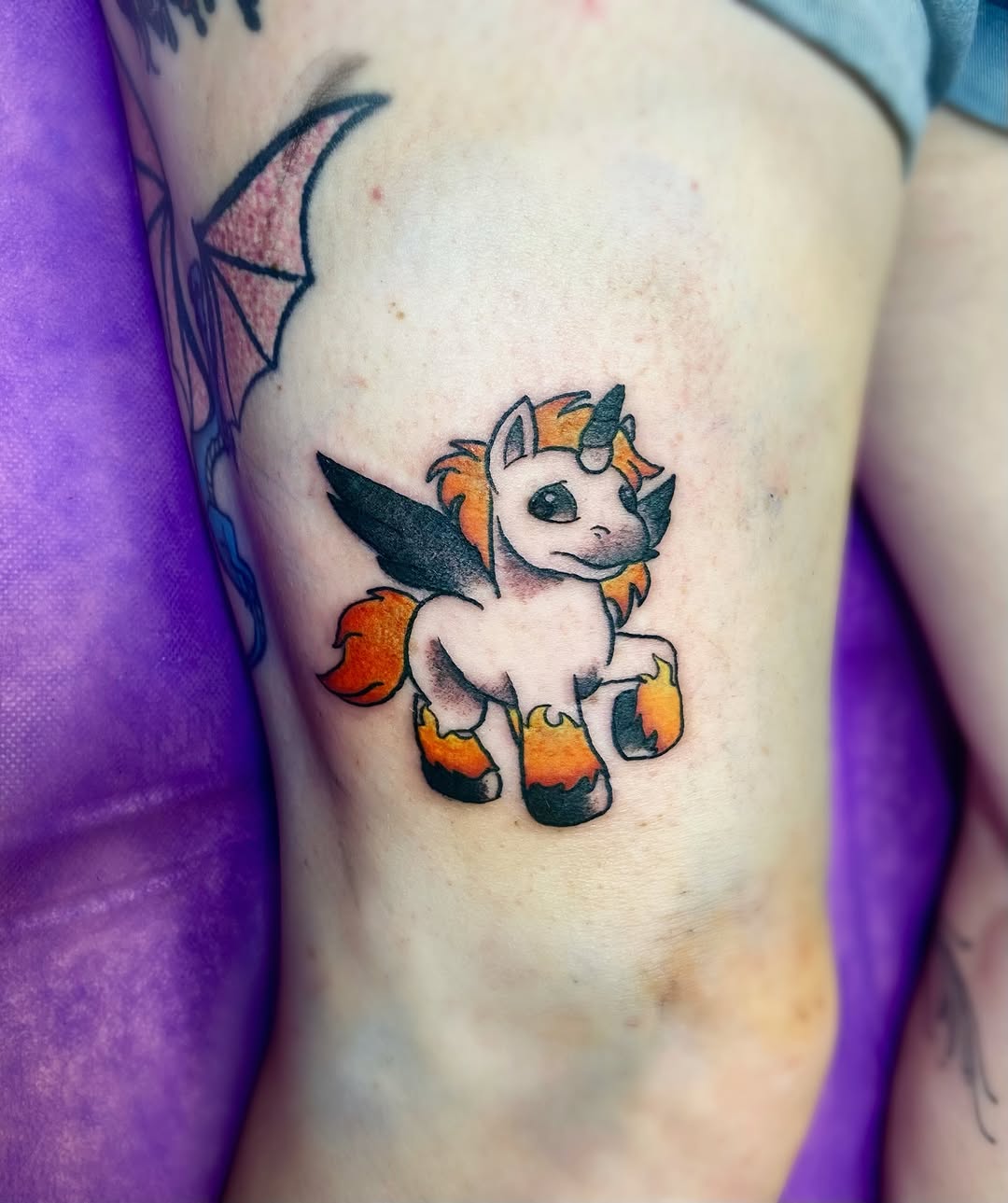 Mythical creature new school tattoo on the thigh by Shay Cole