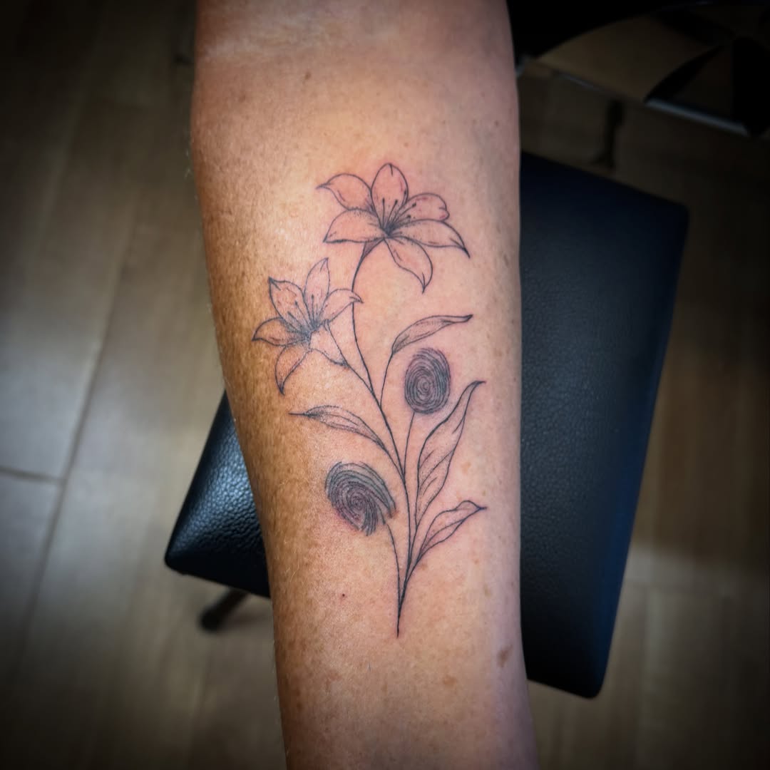 Flowers black and grey tattoo on the forearm by TolzinInk, Brookings, South Dakota