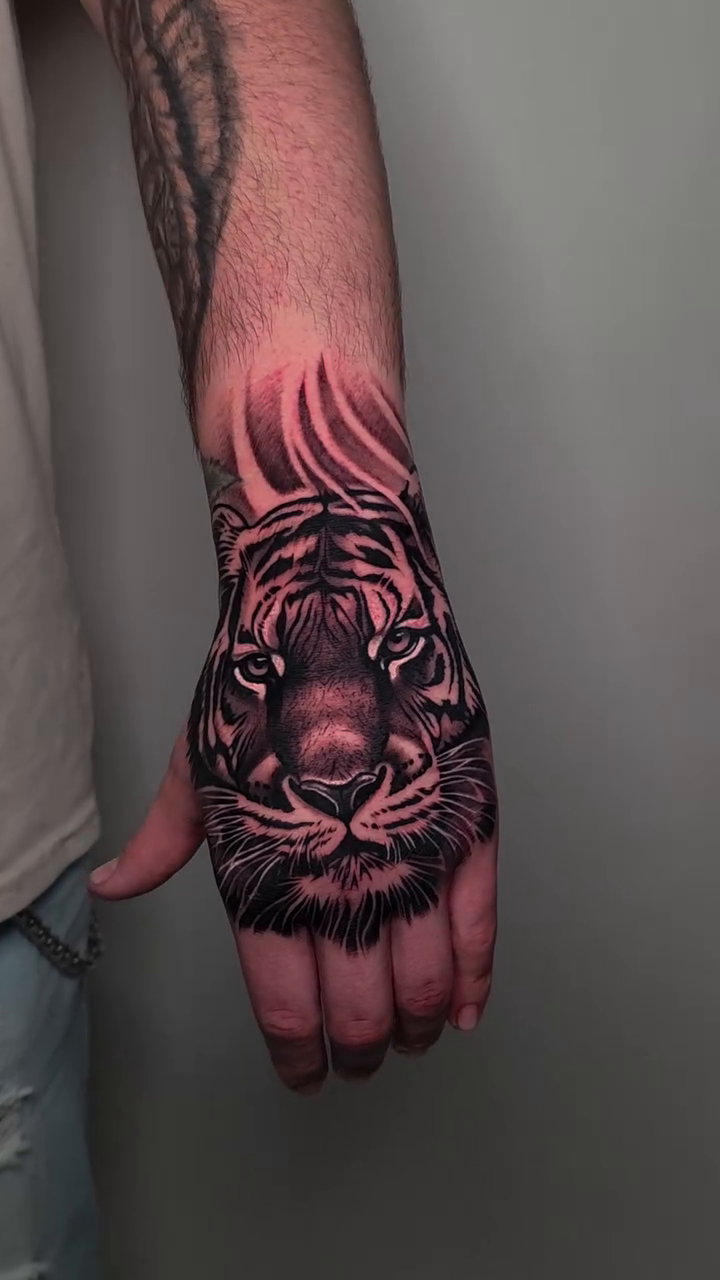 Tiger face realism tattoo by Lukasz Olszanski