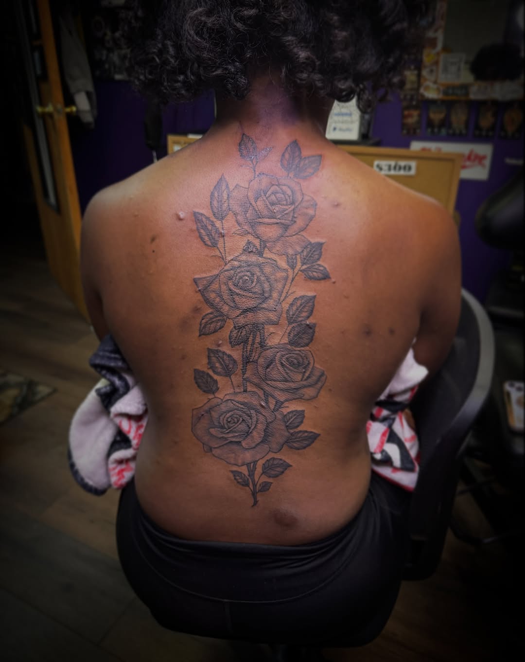 Roses black and grey tattoo on the back by Christian Goines, Memphis, Tennessee