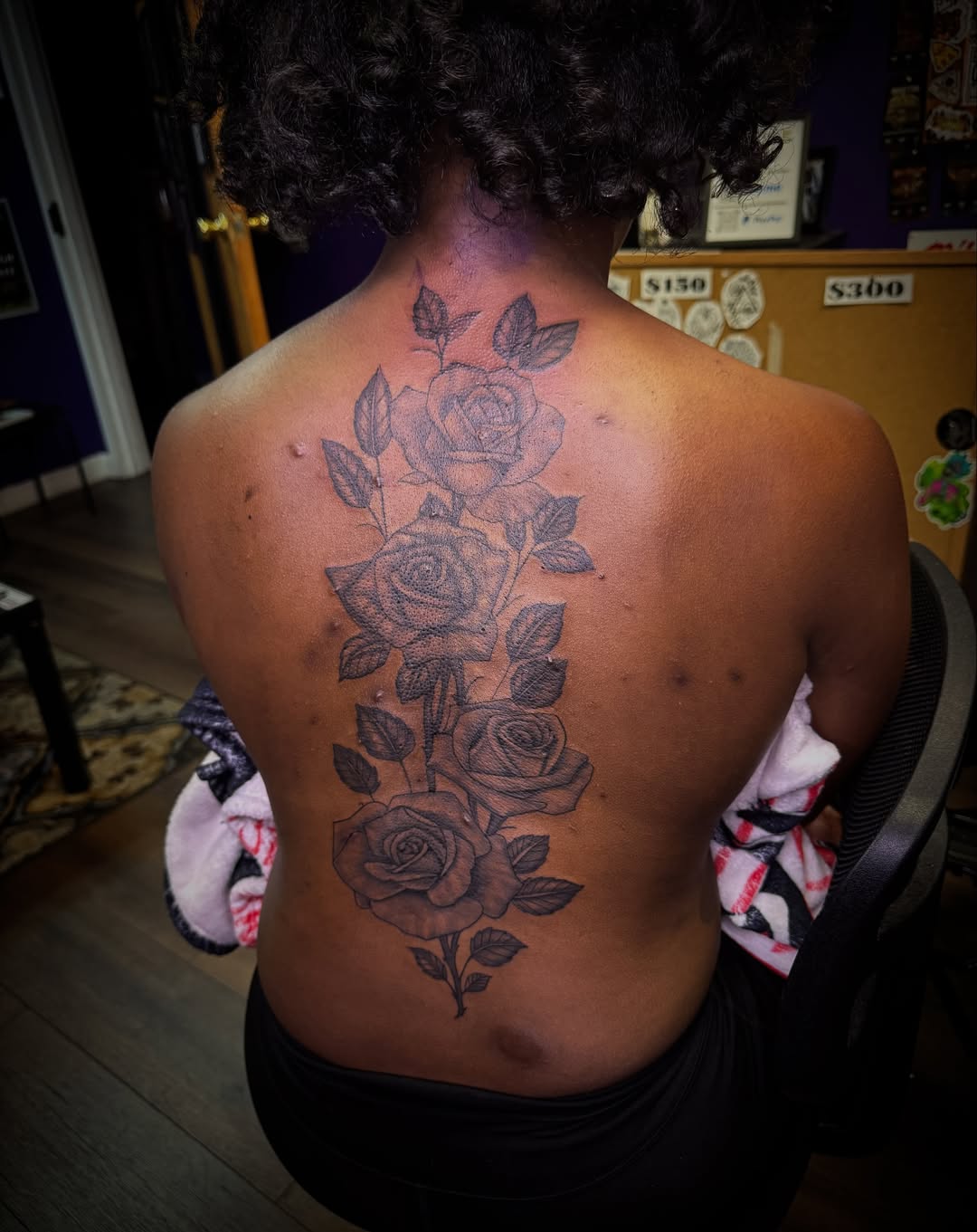 Roses black and grey tattoo on the back by Christian Goines, Memphis, Tennessee