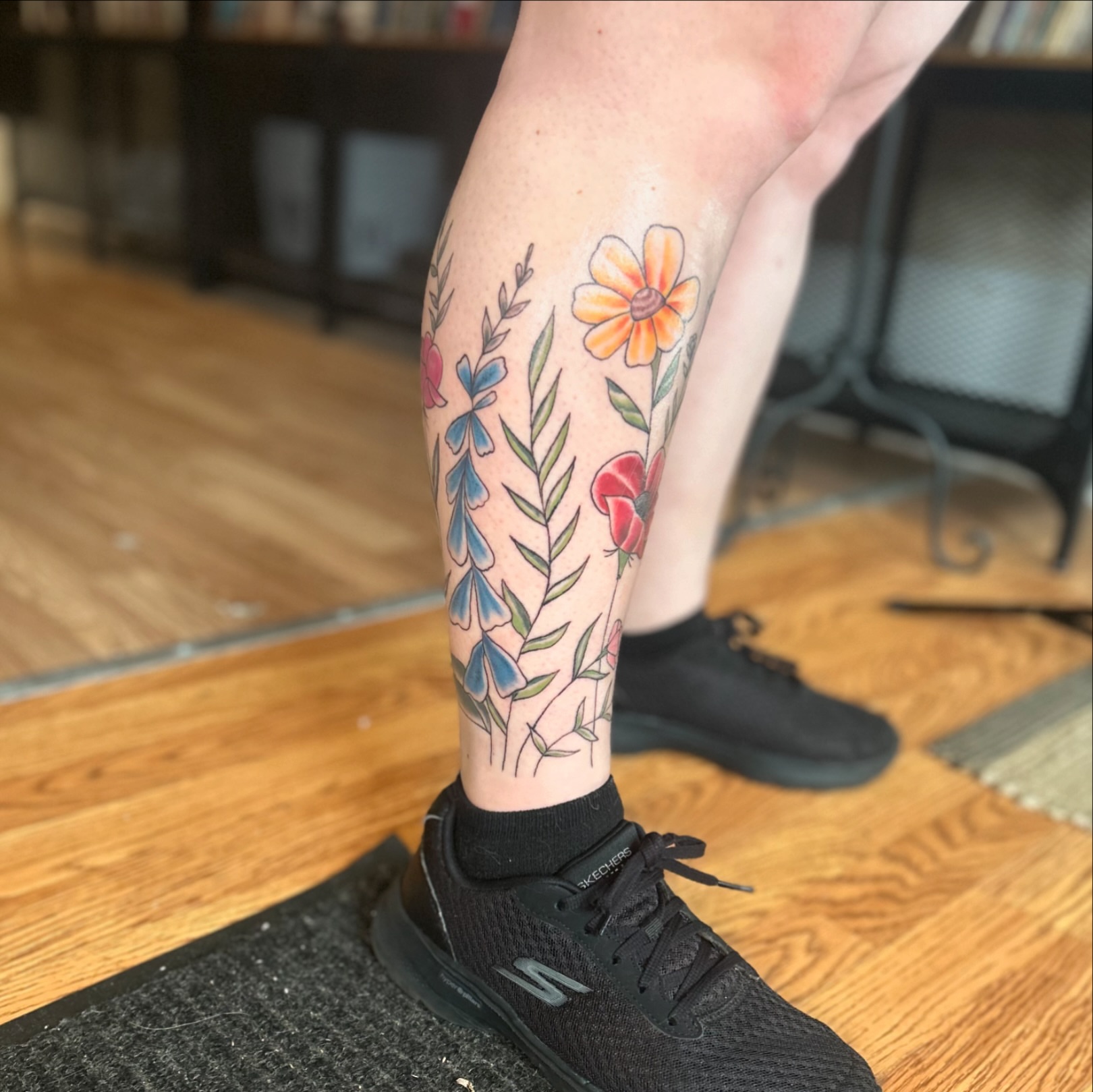 Floral arrangement American traditional tattoo on the calf by Tori Magill