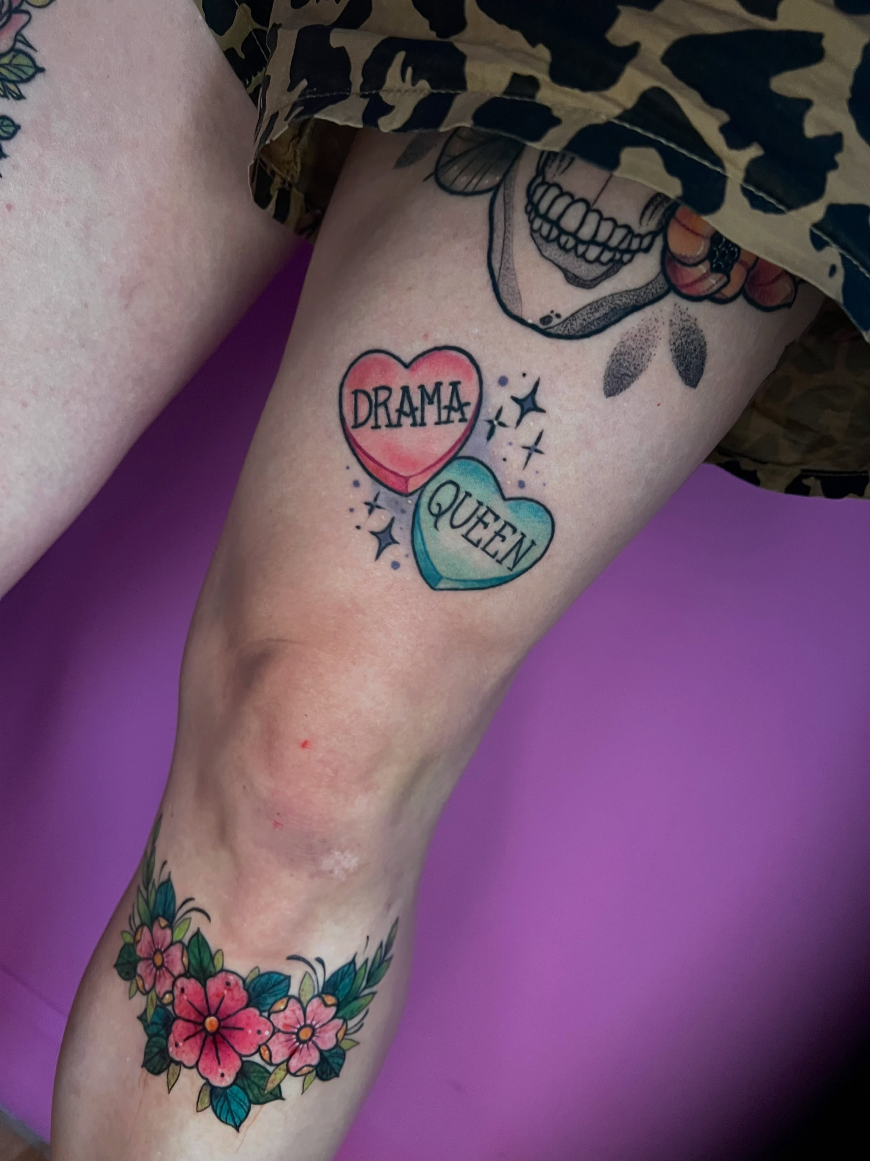 Heart-shaped pendants American traditional tattoo on the forearm by jessica valentine