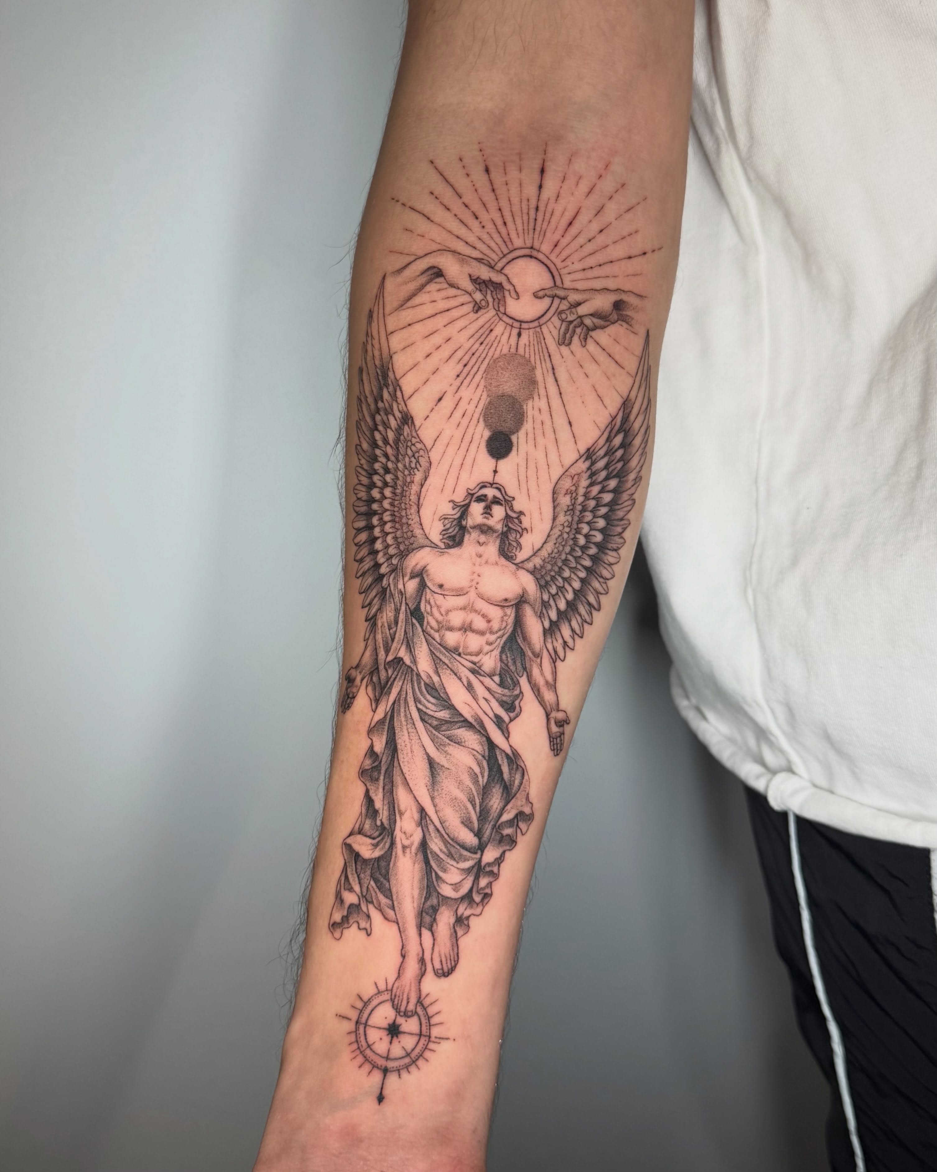 Angelic figure realism tattoo on the forearm by Felipe Pacifico