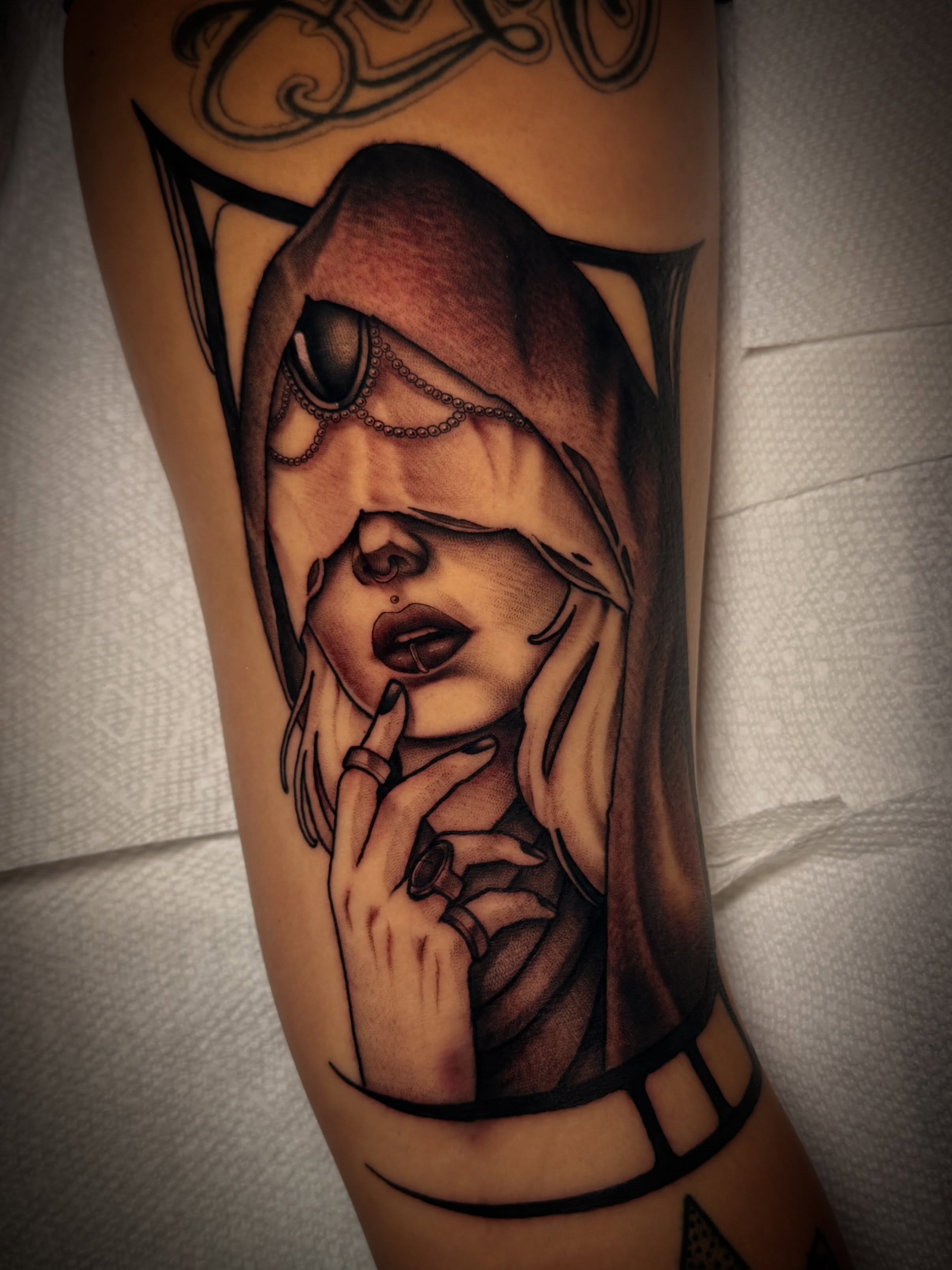 Woman covering eyes realism tattoo on the forearm by Dave Osrowitz