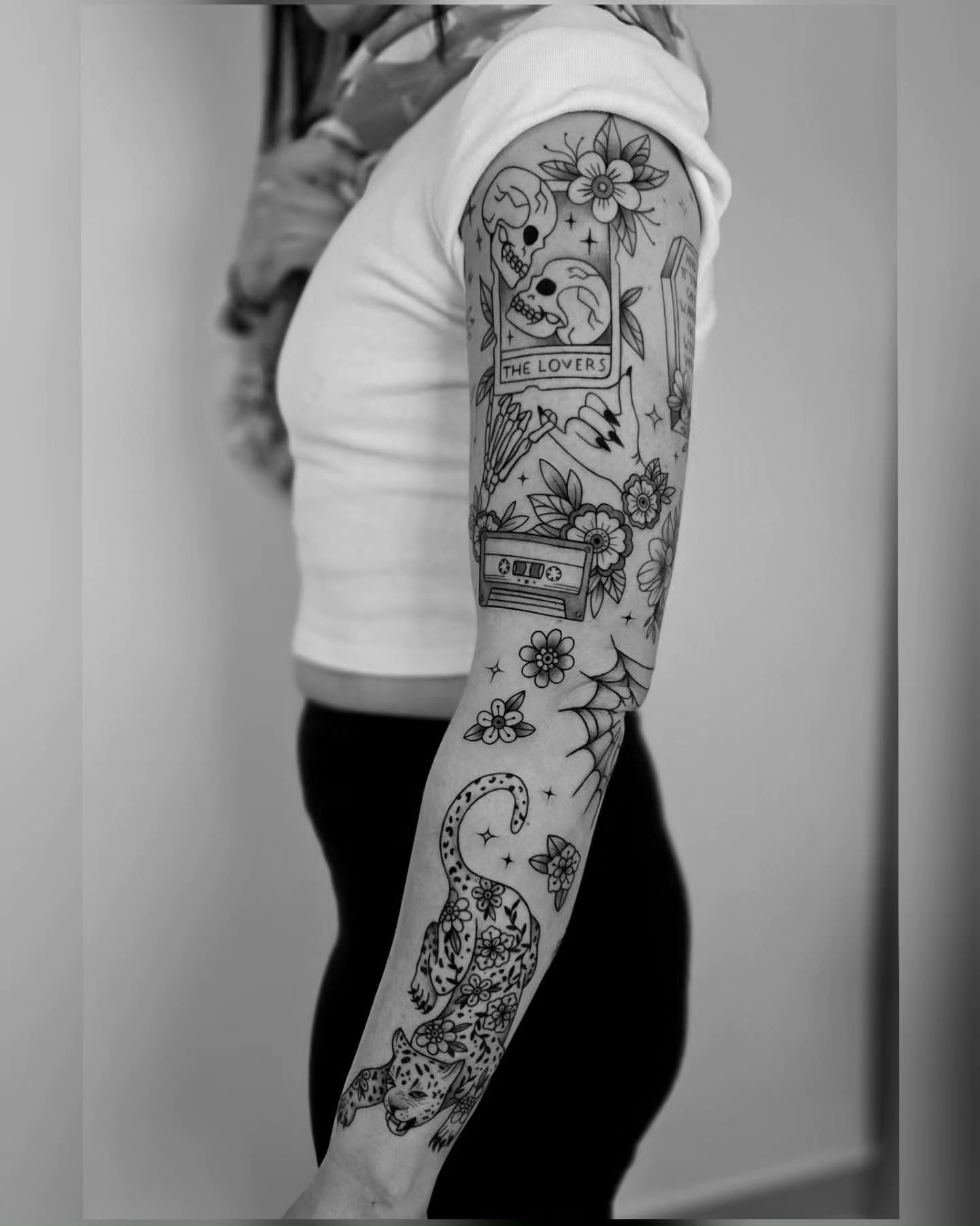 Tarot card and leopard American traditional tattoo on the forearm by Kirstie Lew Tattoo