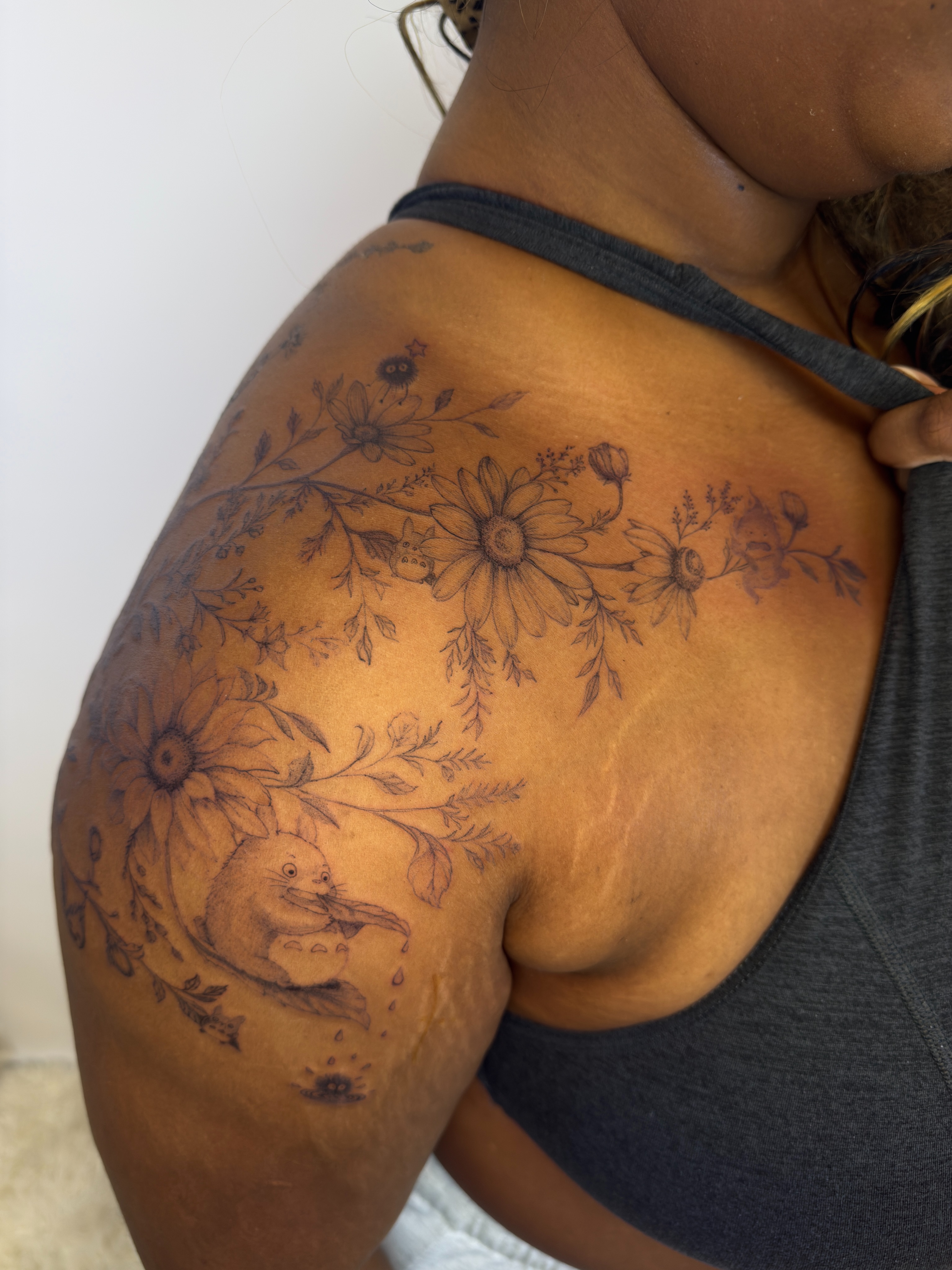 Flower and creature black and grey tattoo on the shoulder by Yuri Chloe Ngo Tattoo Artist