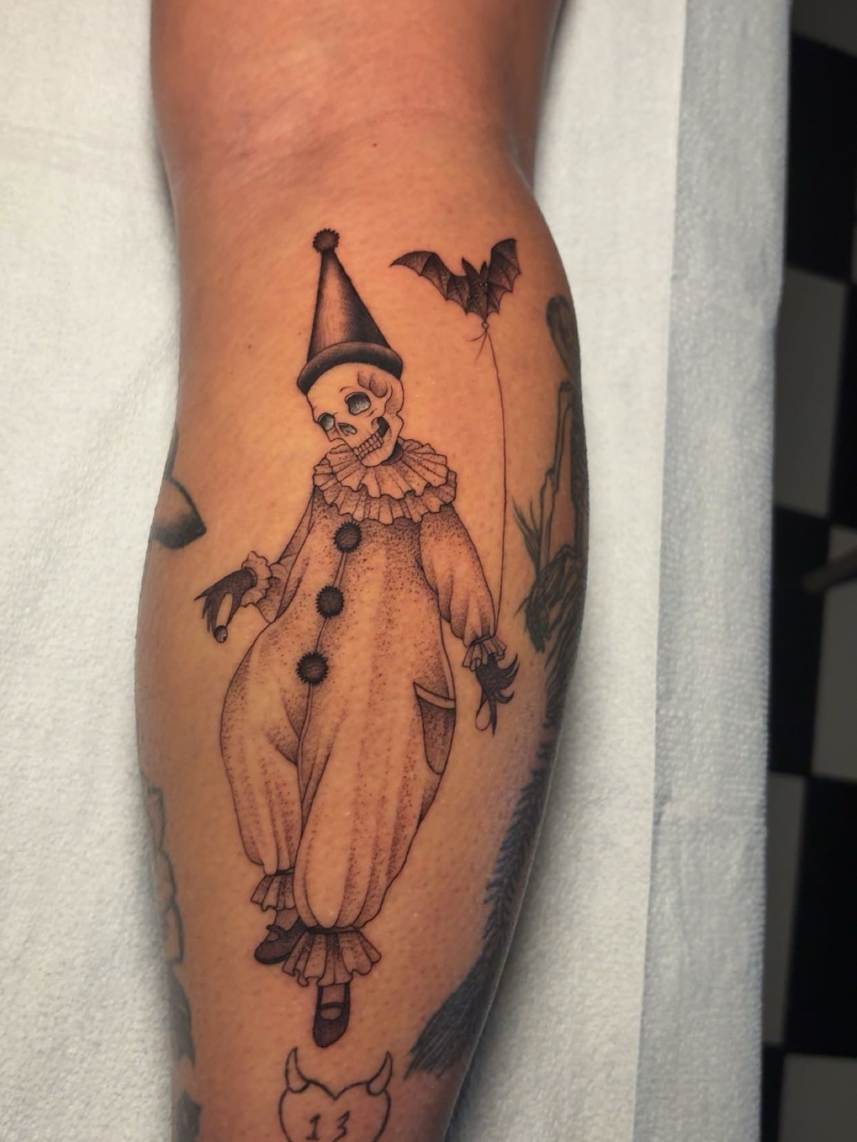 Clown black and grey tattoo on the forearm by Chris Prince Jr., Miamisburg, Ohio