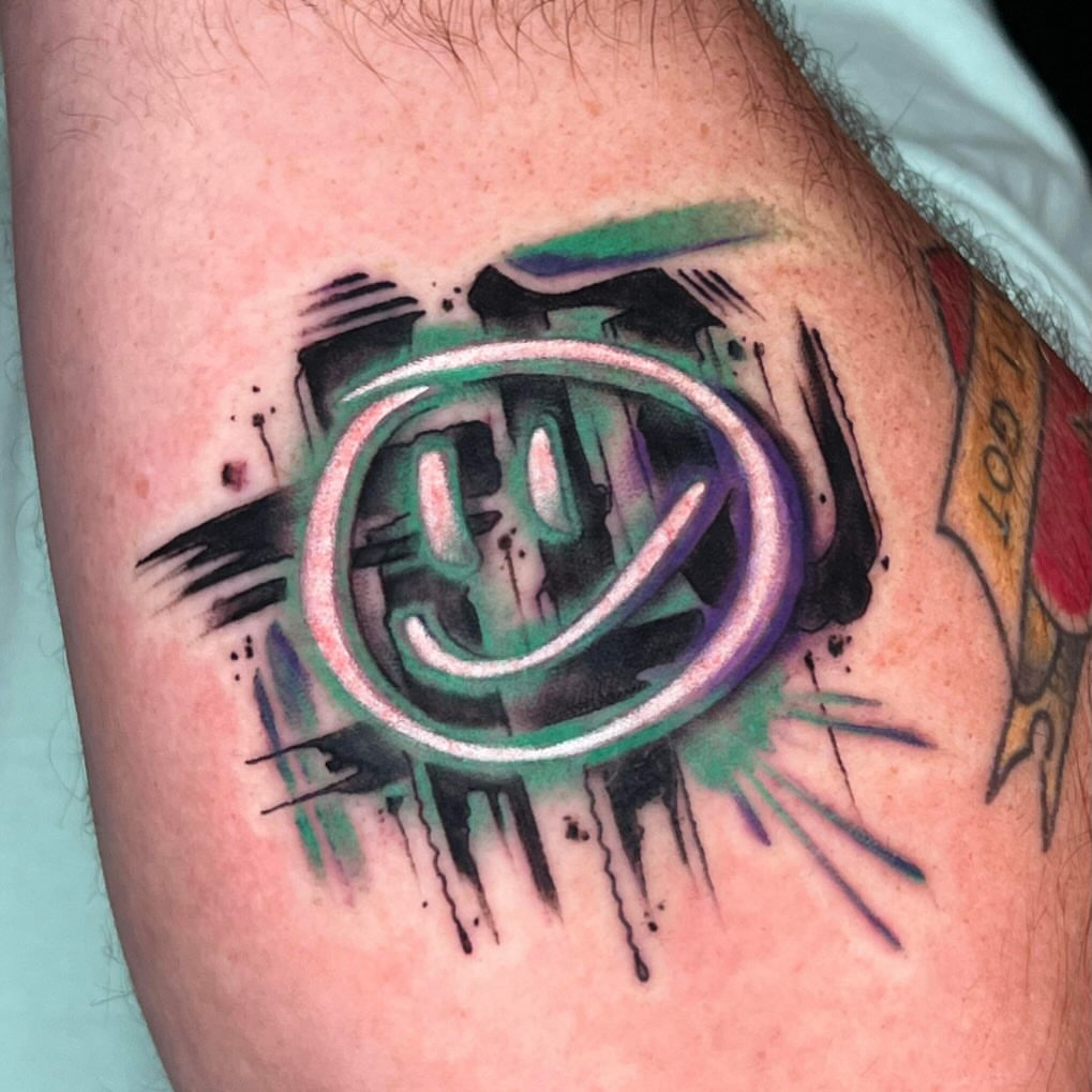 Abstract design watercolor tattoo on the forearm by Cuda