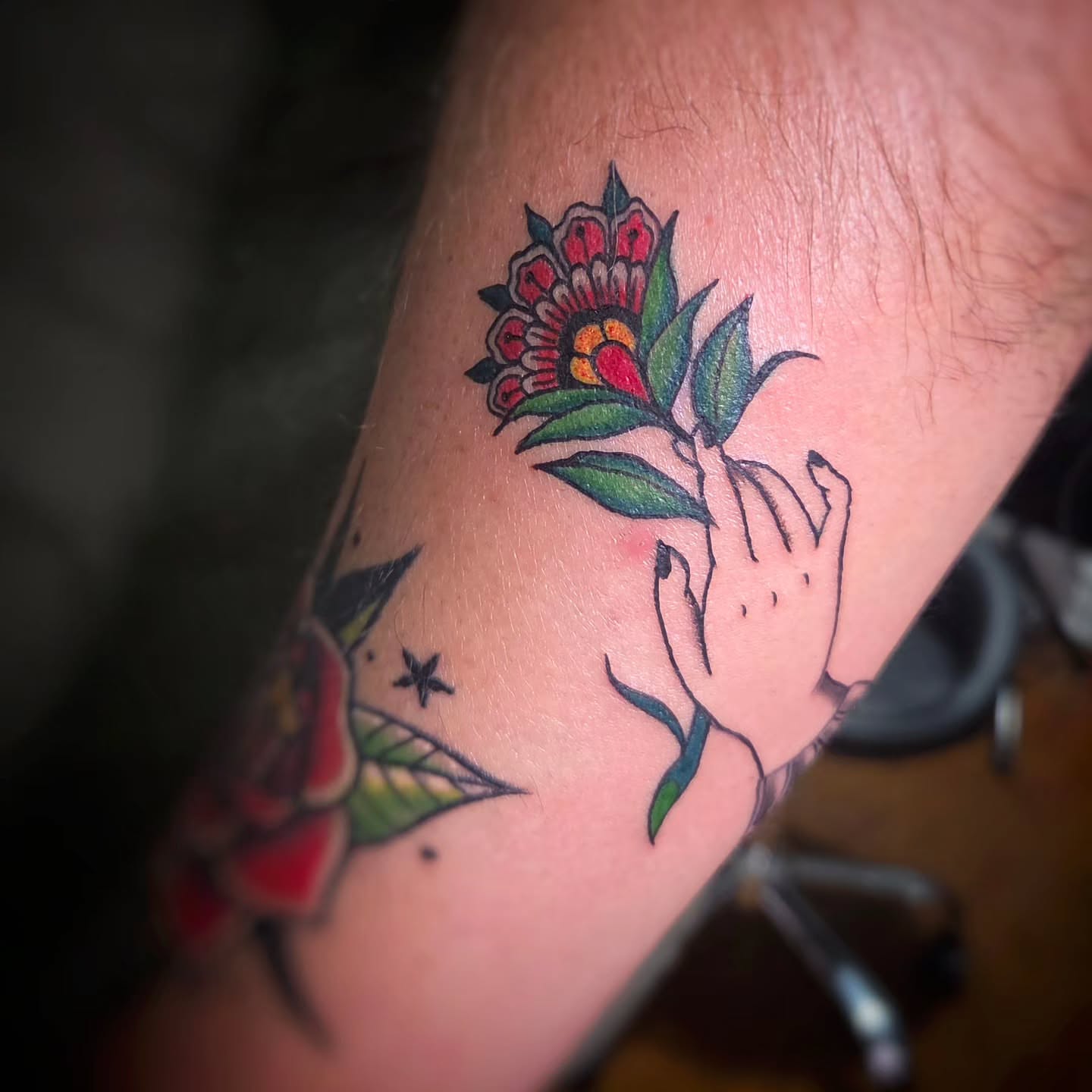 Flower and hand American traditional tattoo on the forearm by Jam ⚡️🐉🖤