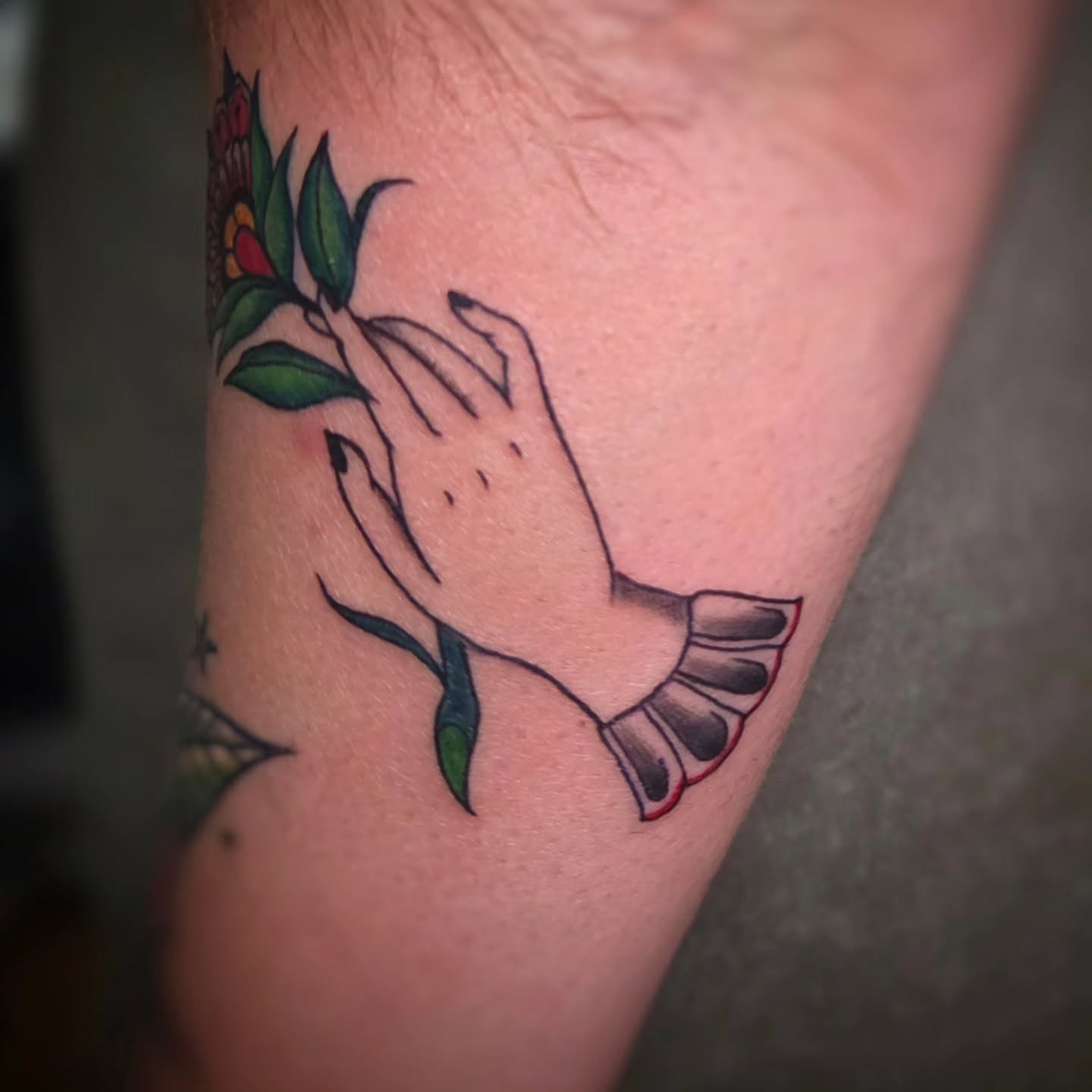 Praying hands with flower American traditional tattoo on the forearm by Jam ⚡️🐉🖤