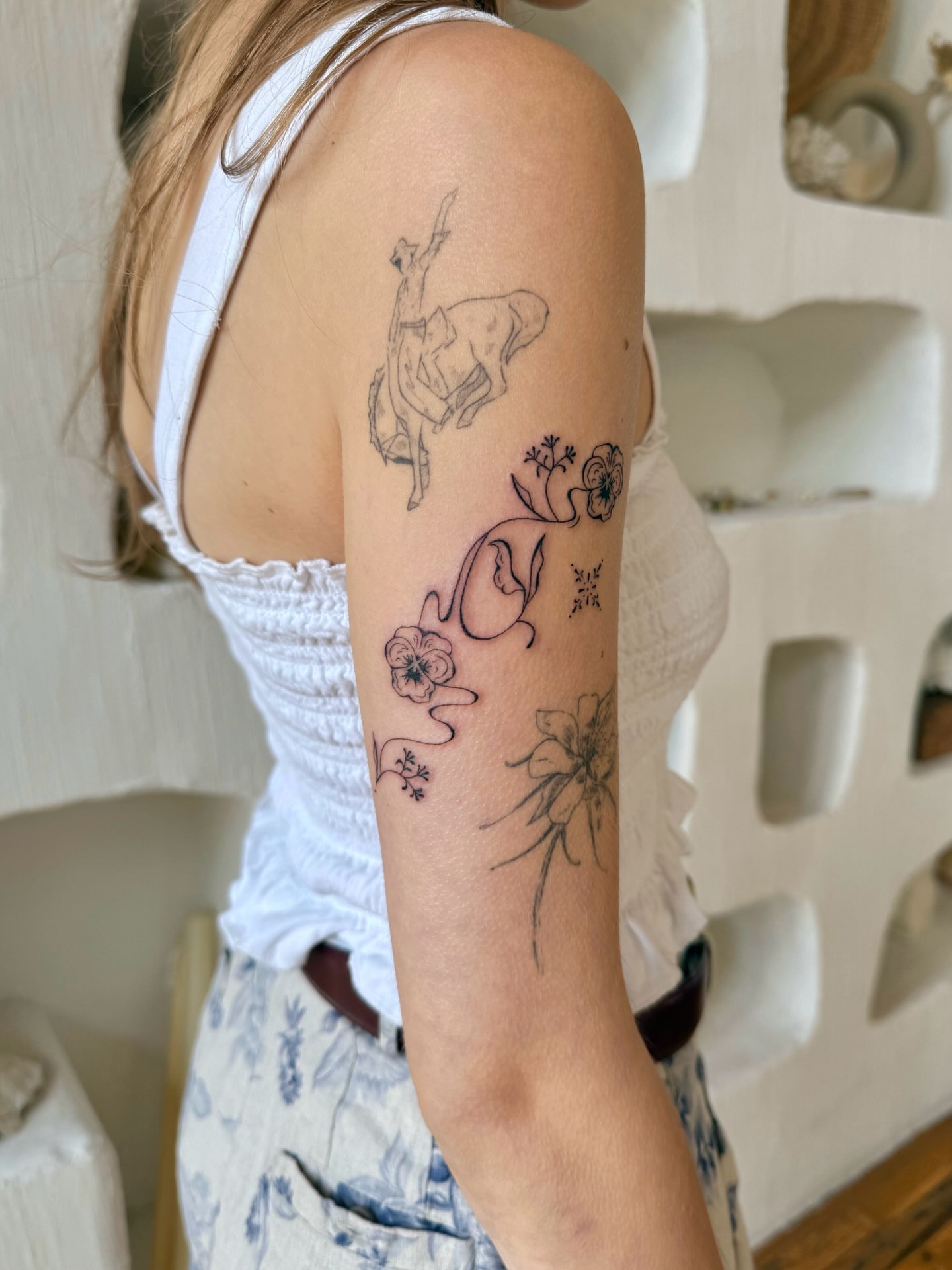 Horse and floral black and grey tattoo on the forearm by Shilo Gold 🍒