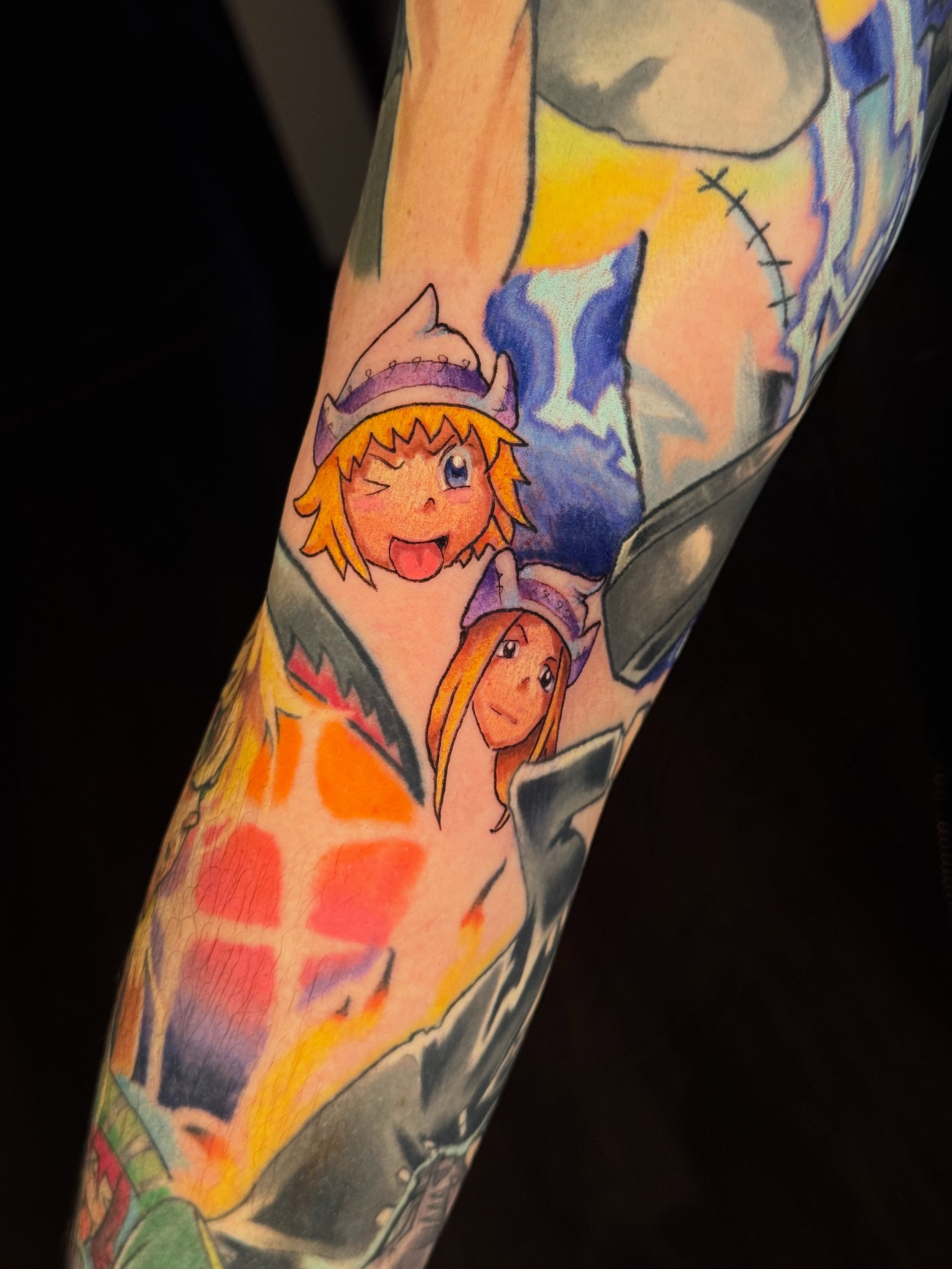 Anime characters anime tattoo on the forearm by Anna Saveria