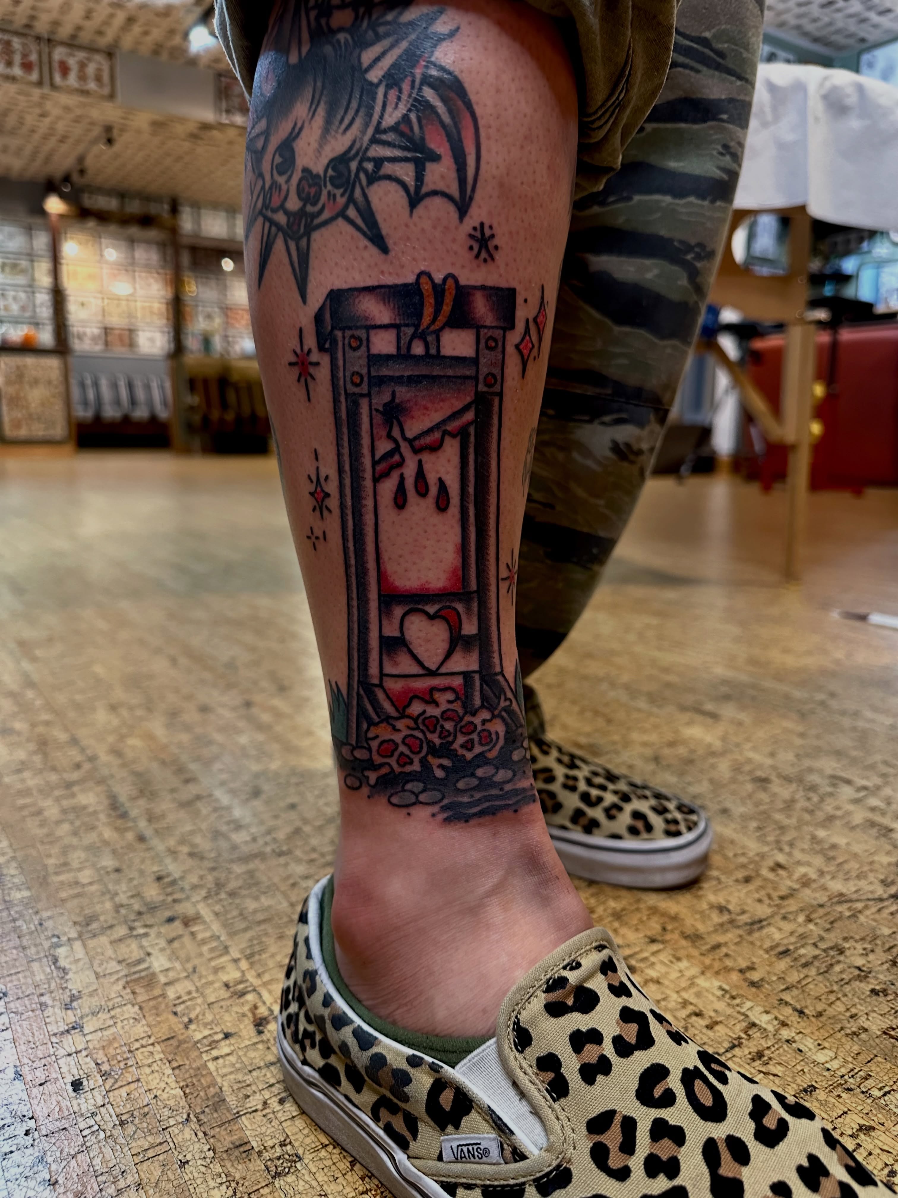 Guillotine American traditional tattoo on the calf by teddy, Portland, Oregon