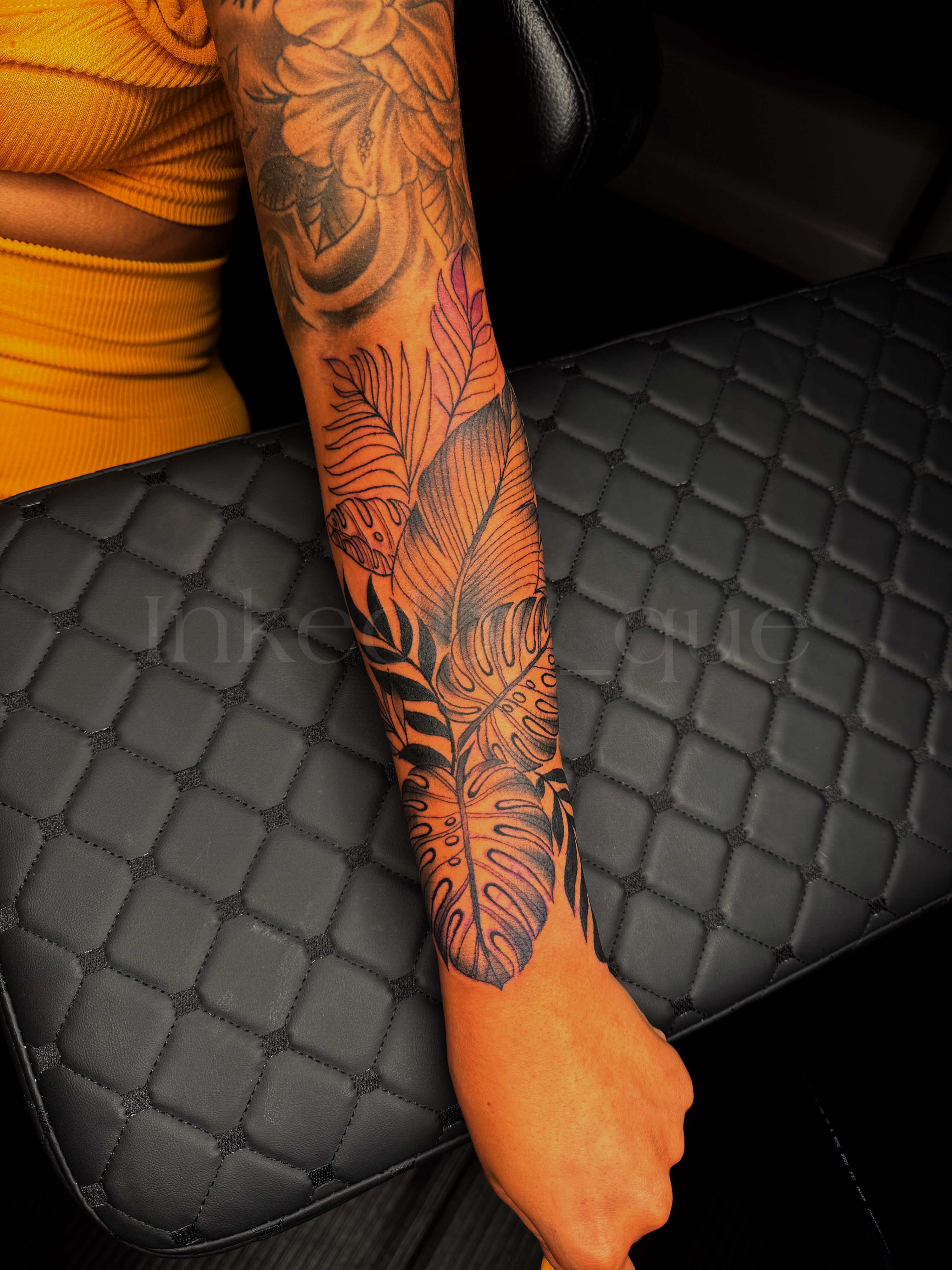 Feather and leaves neo-traditional tattoo on the forearm by Q⚜️