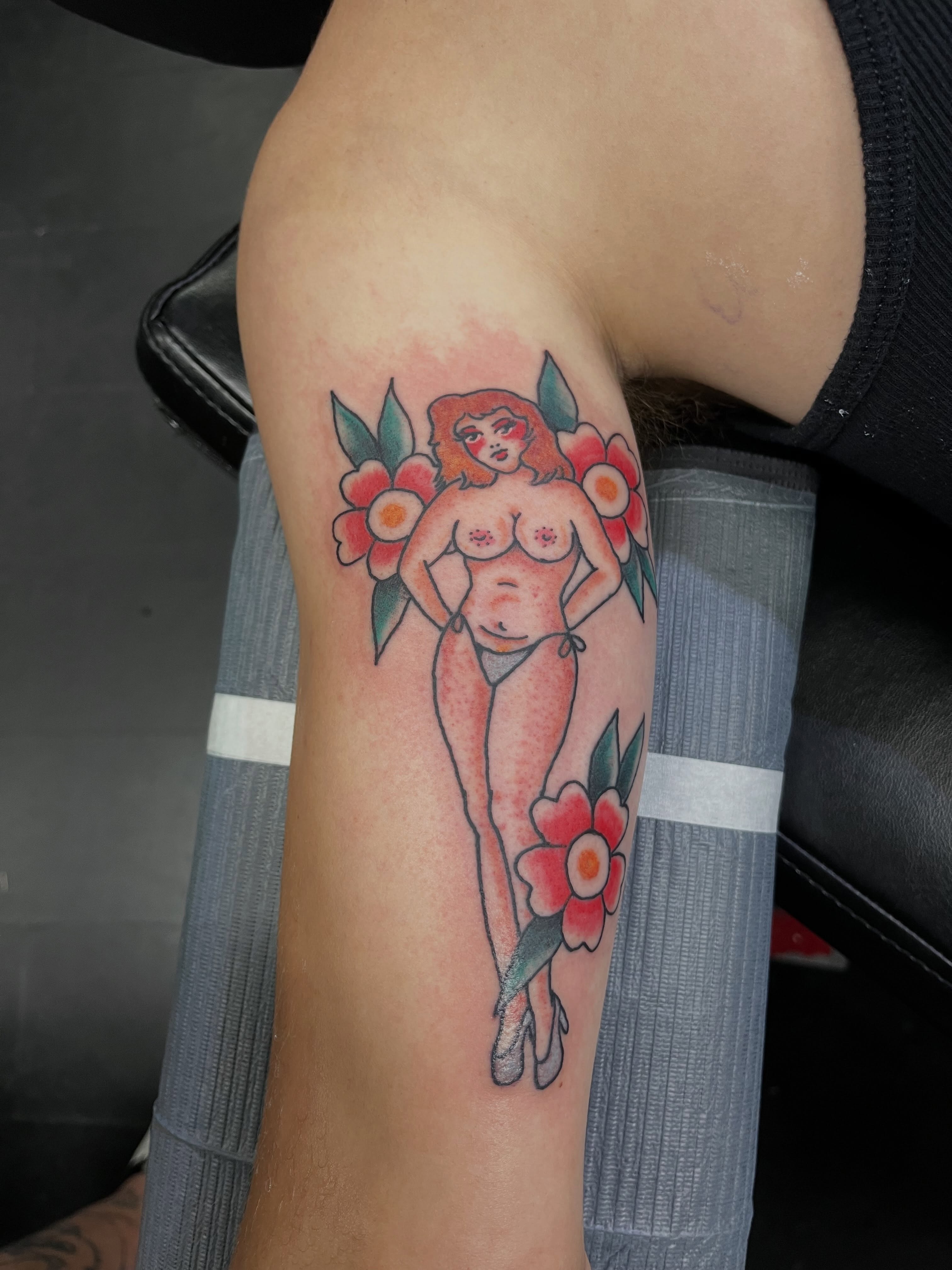 Pin-up girl American traditional tattoo on the forearm by CRAIG B⛓️ Cincinnati Tattoo Artist