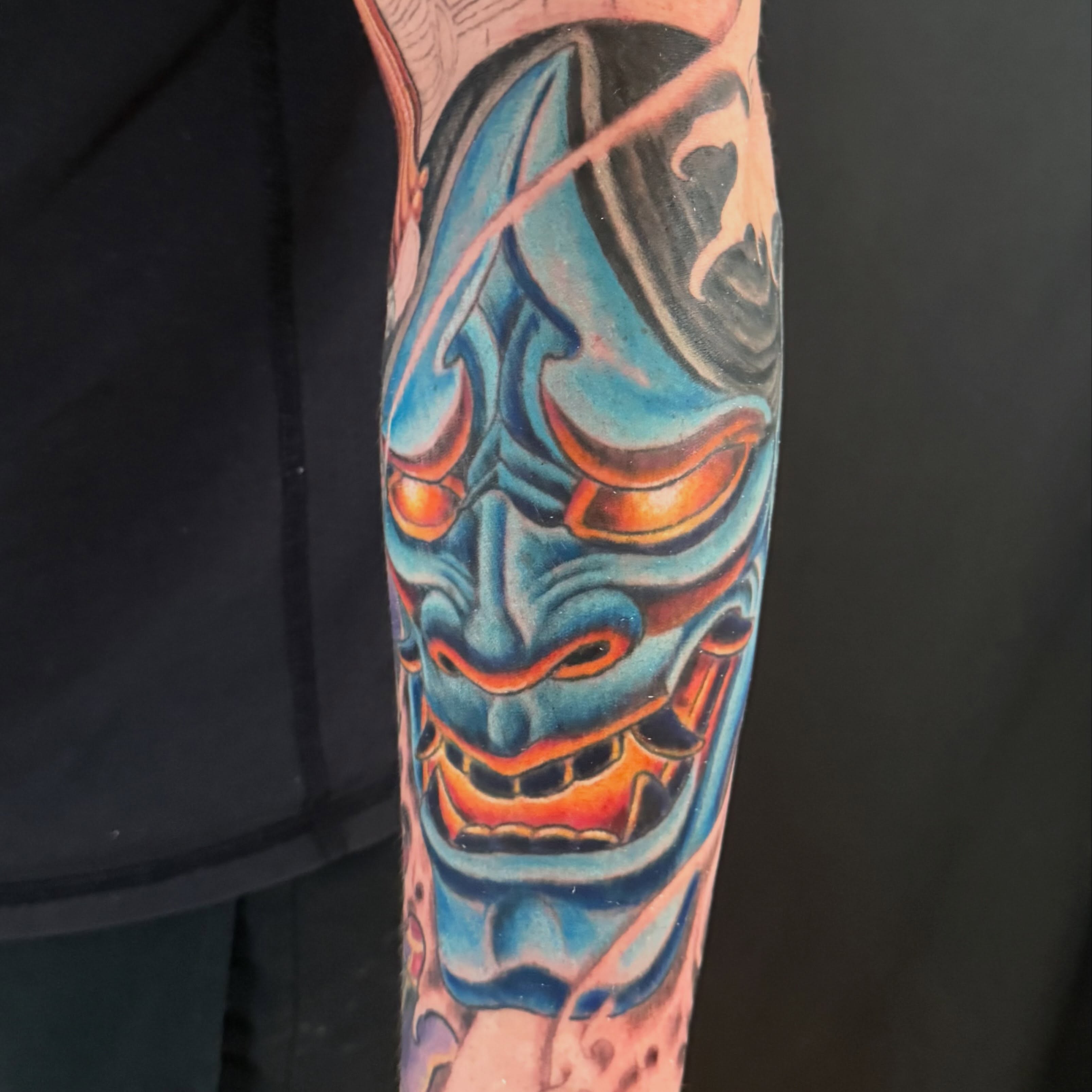 Mask japanese irezumi tattoo on the forearm by Patrick Cornolo