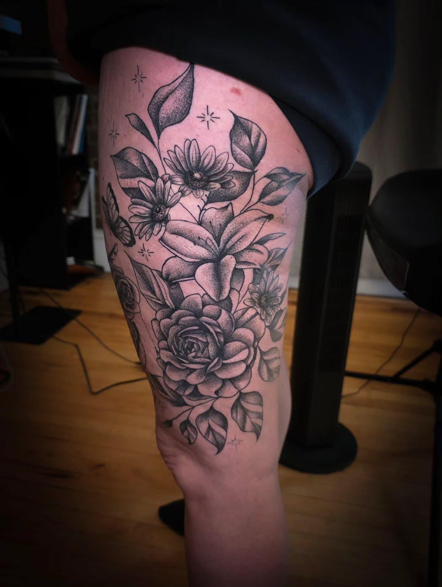 Floral bouquet dotwork tattoo on the thigh by John Christo Blake