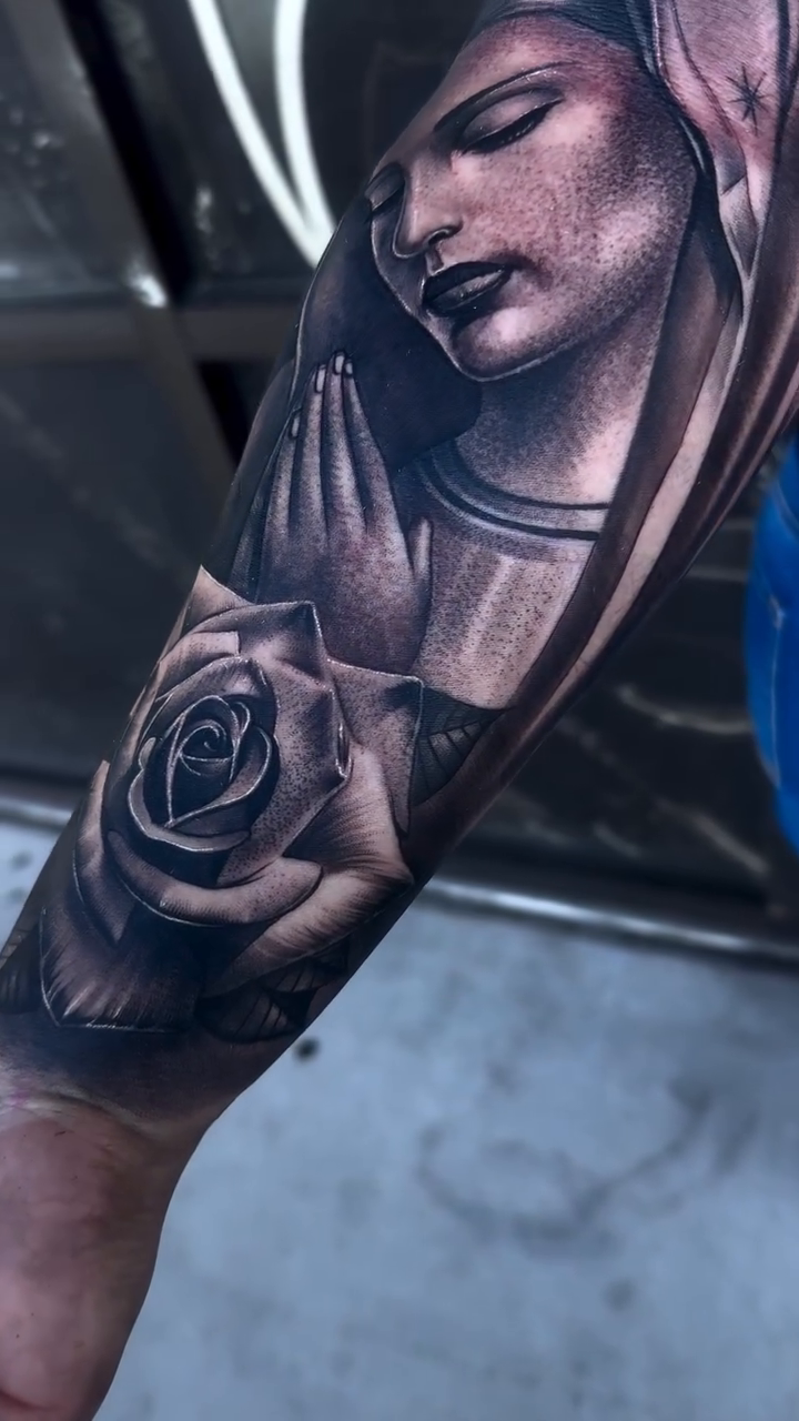Virgin Mary and rose realism tattoo by Tattoo