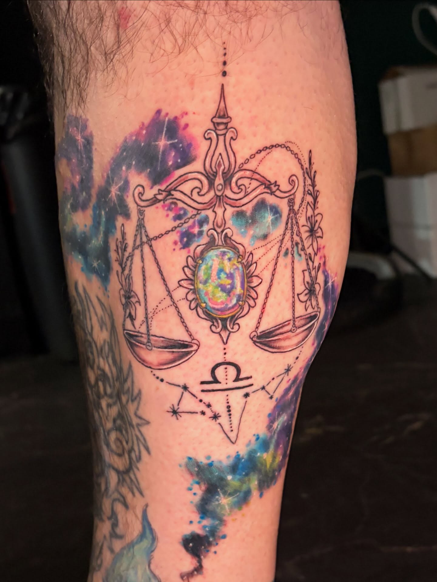 Libra scales dotwork tattoo on the forearm by Fredrick Tigerman