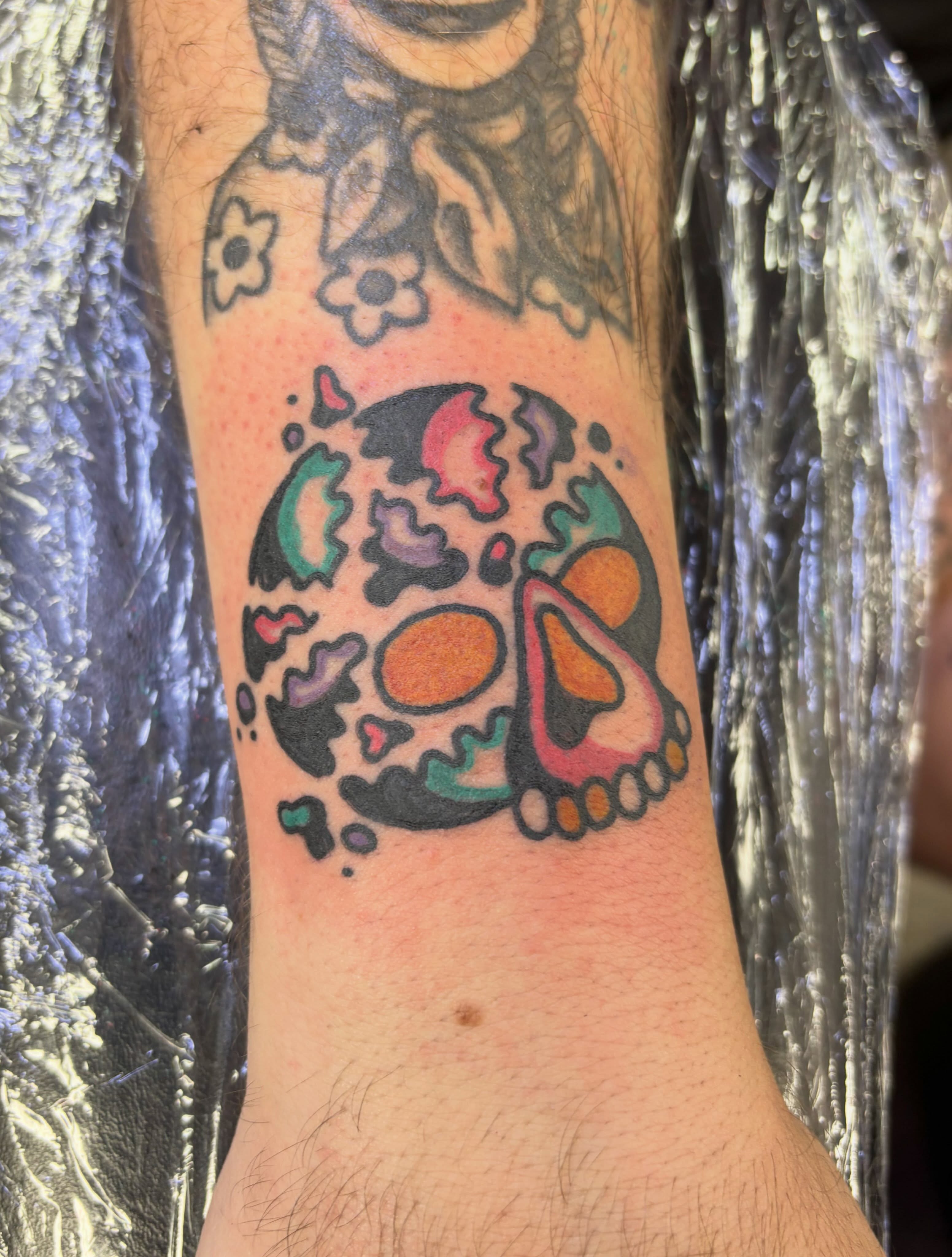Abstract skull dotwork tattoo on the forearm by Dave