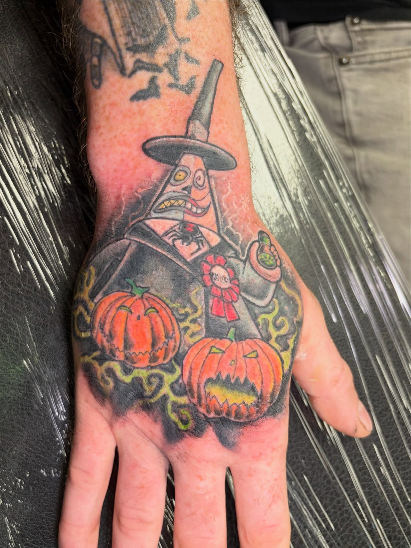 Halloween witch American traditional tattoo on the hand by Fredrick Tigerman