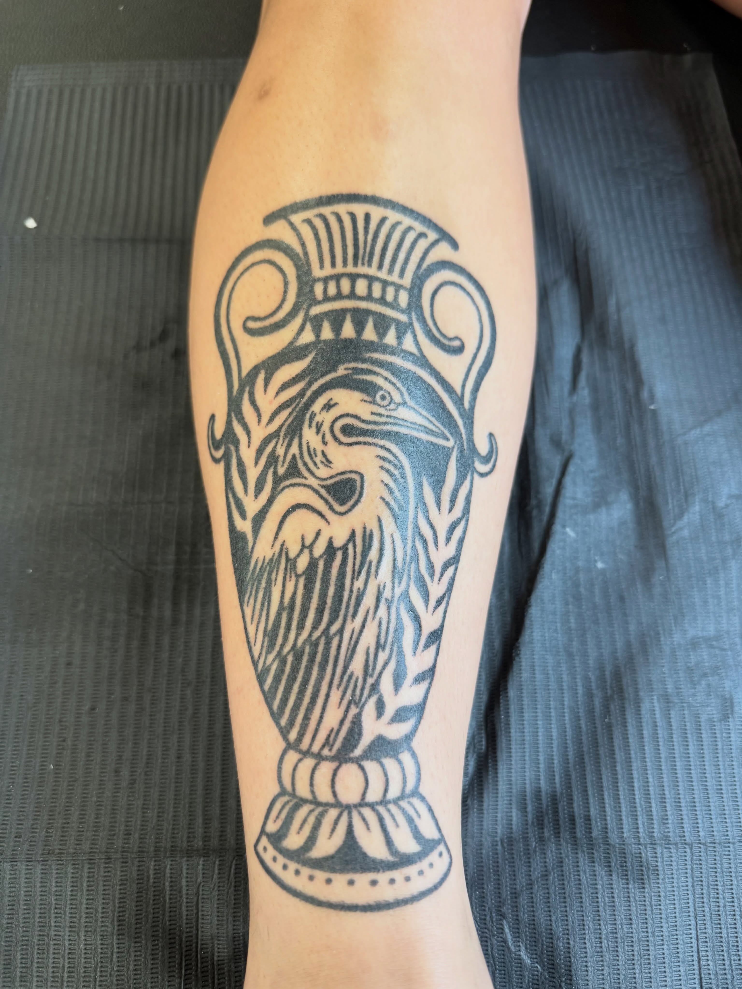Ancient vase with bird black and grey tattoo on the forearm by Melia Mariko