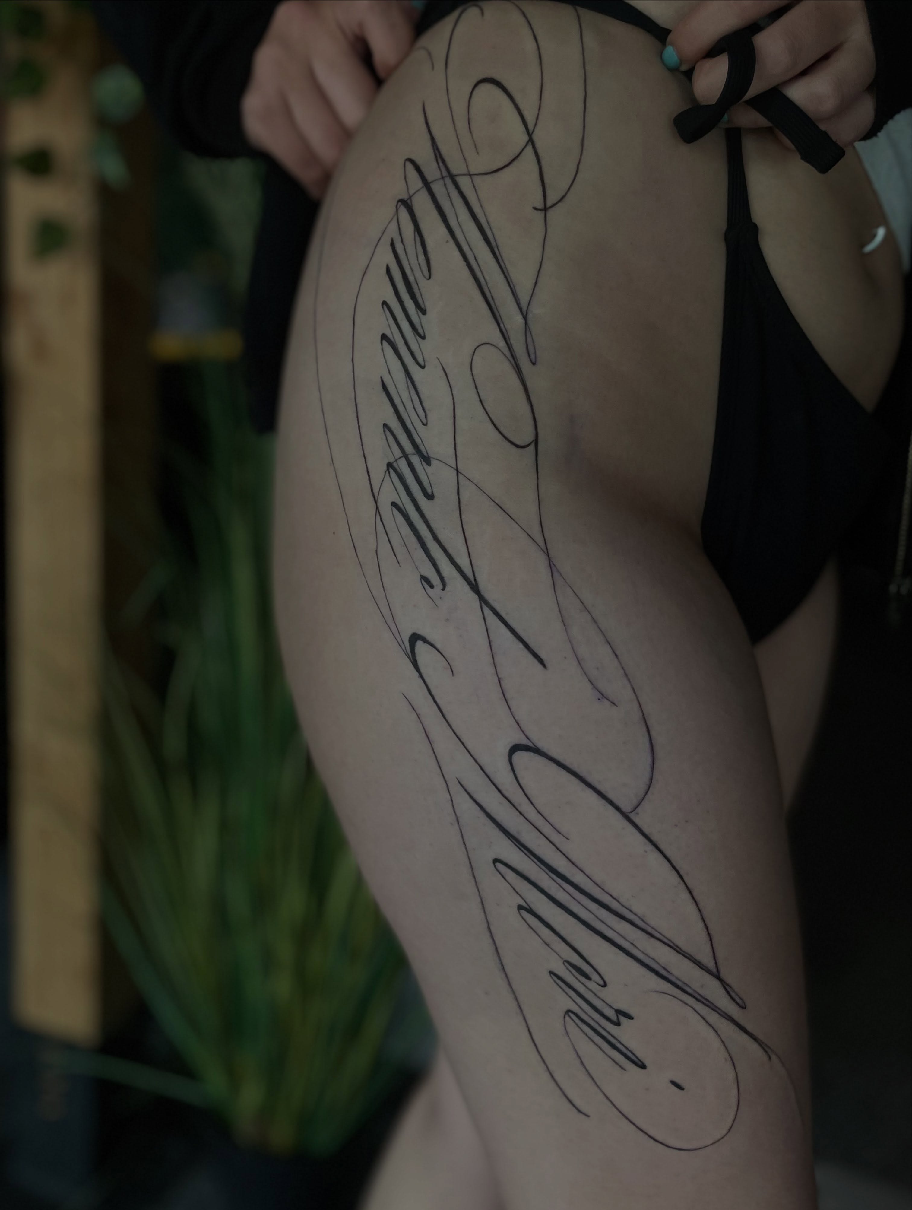 Script lettering lettering script tattoo on the thigh by Trinity