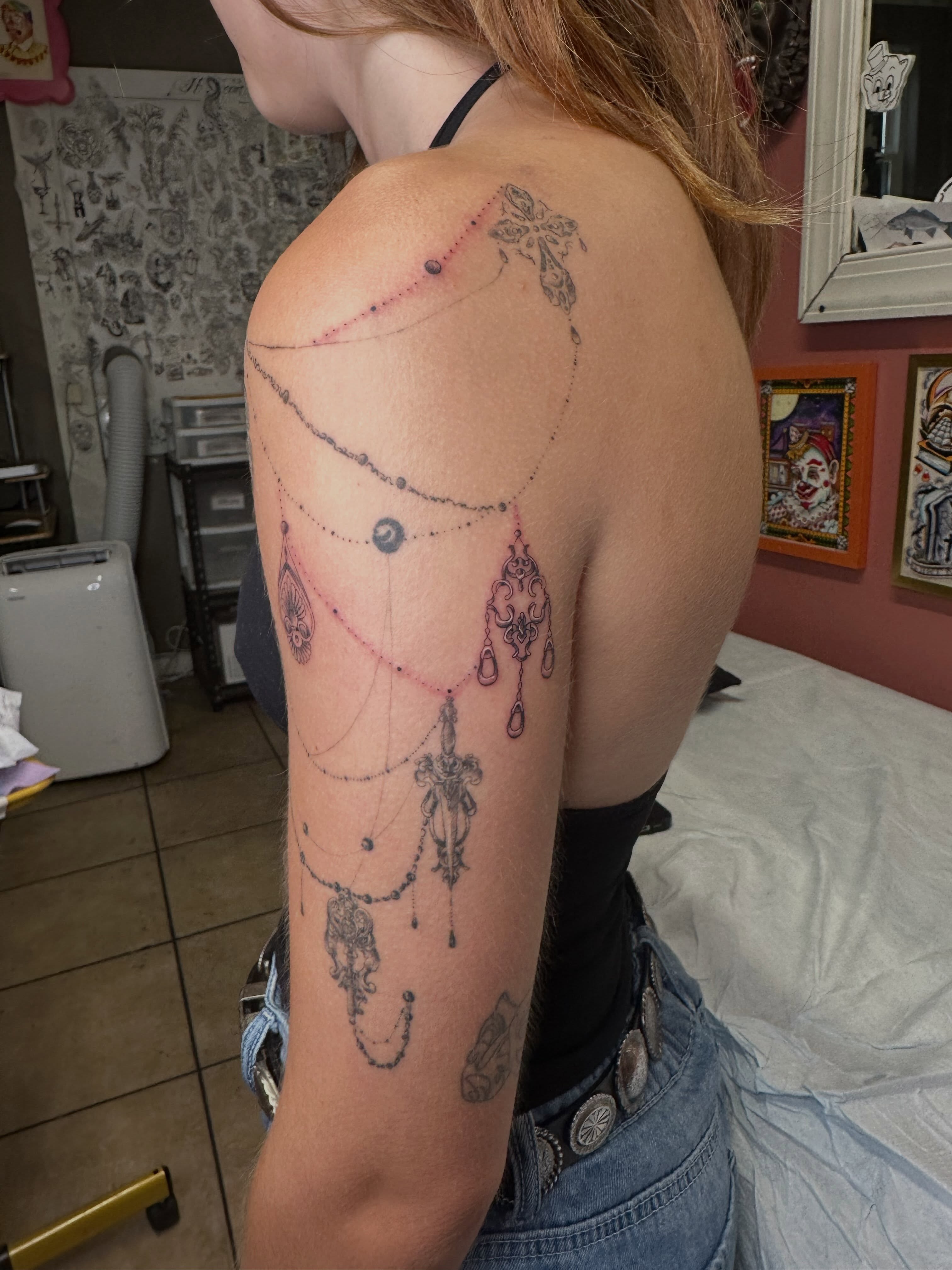 Necklace black and grey tattoo on the shoulder by Alex Gunshefski