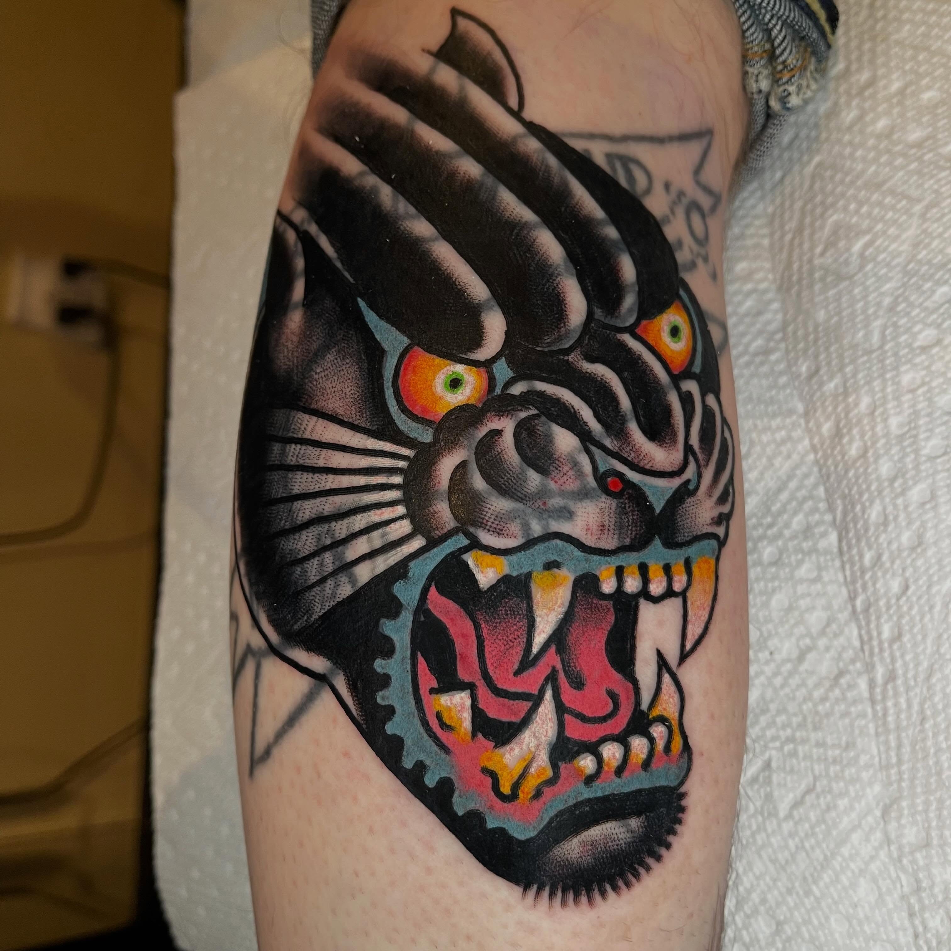 Tiger mask American traditional tattoo on the forearm by Ian Bederman, Austin, Texas