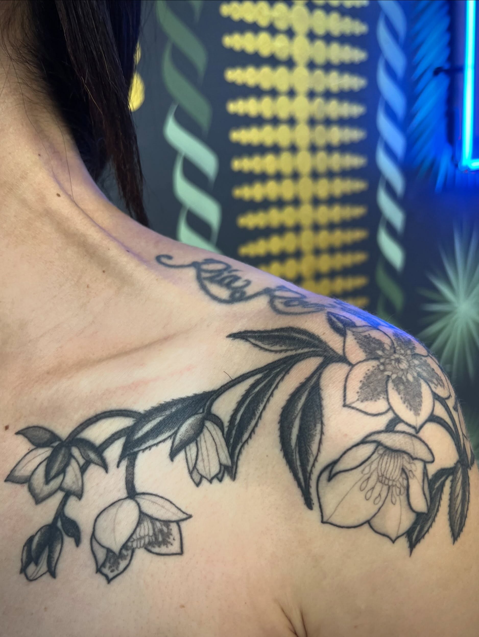 Flowers and leaves black and grey tattoo on the shoulder by Natalie Phillips, Oakland, California