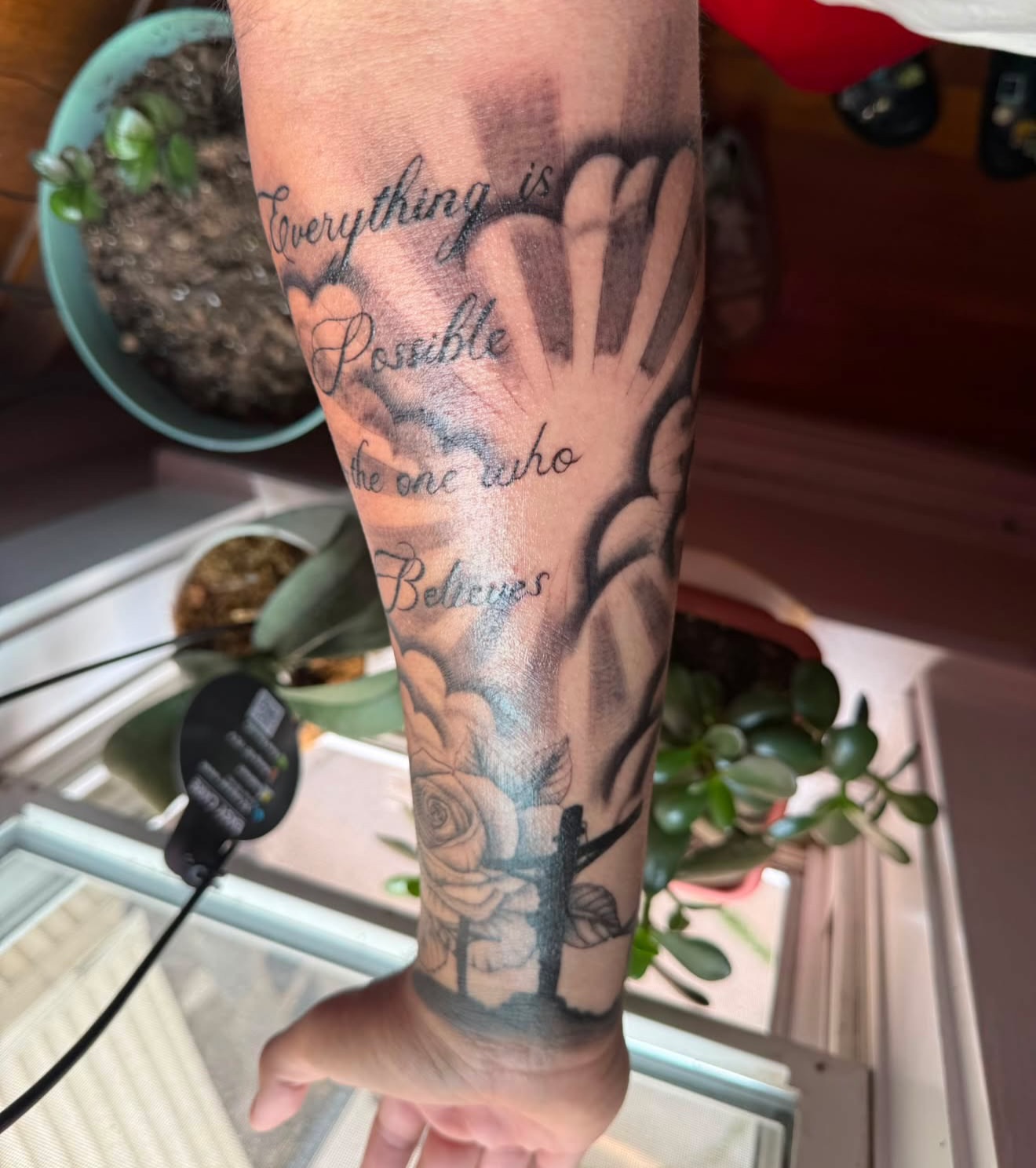 Motivational quote black and grey tattoo on the forearm by Destineé