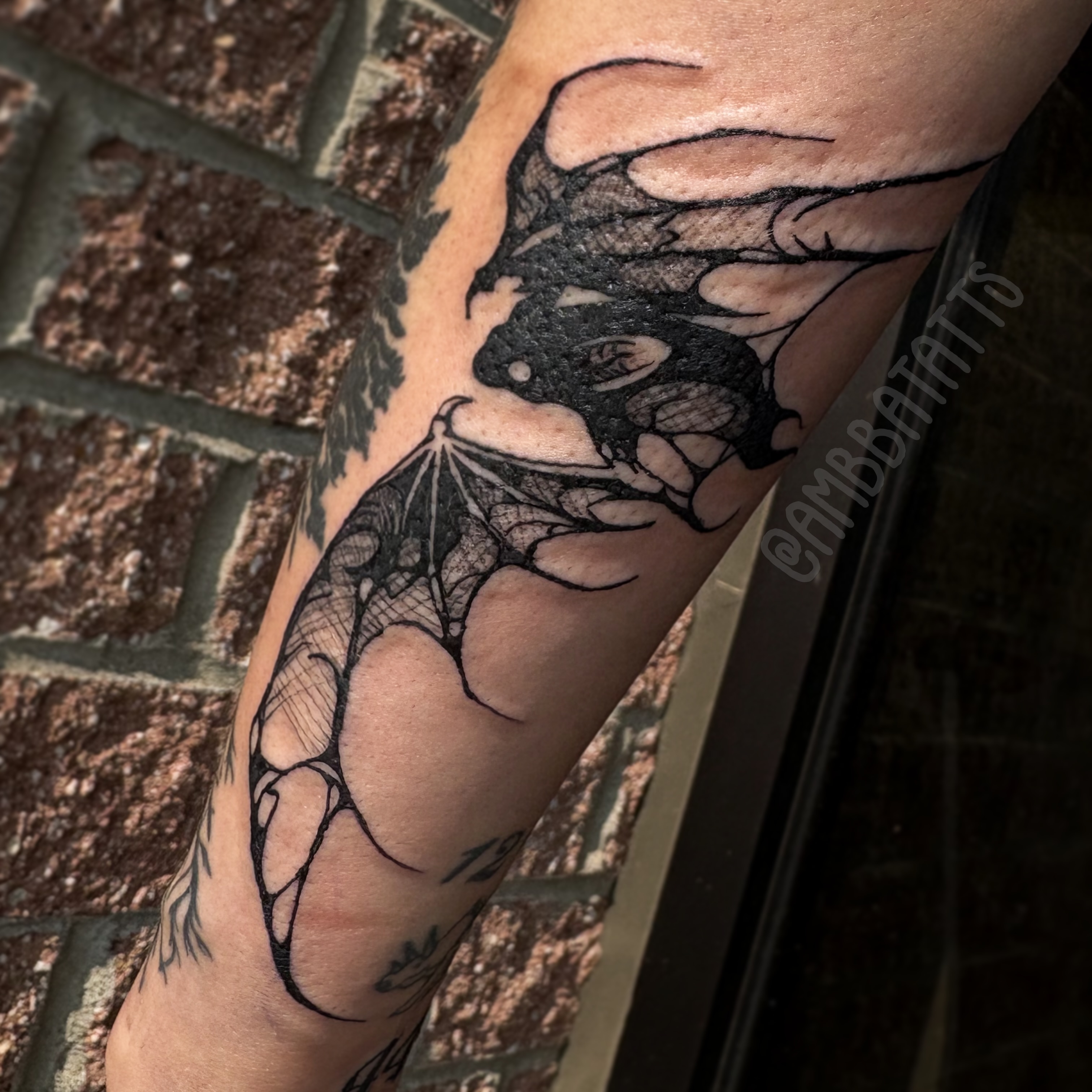 Bat black and grey tattoo on the forearm by amber brady, Brunswick, Ohio