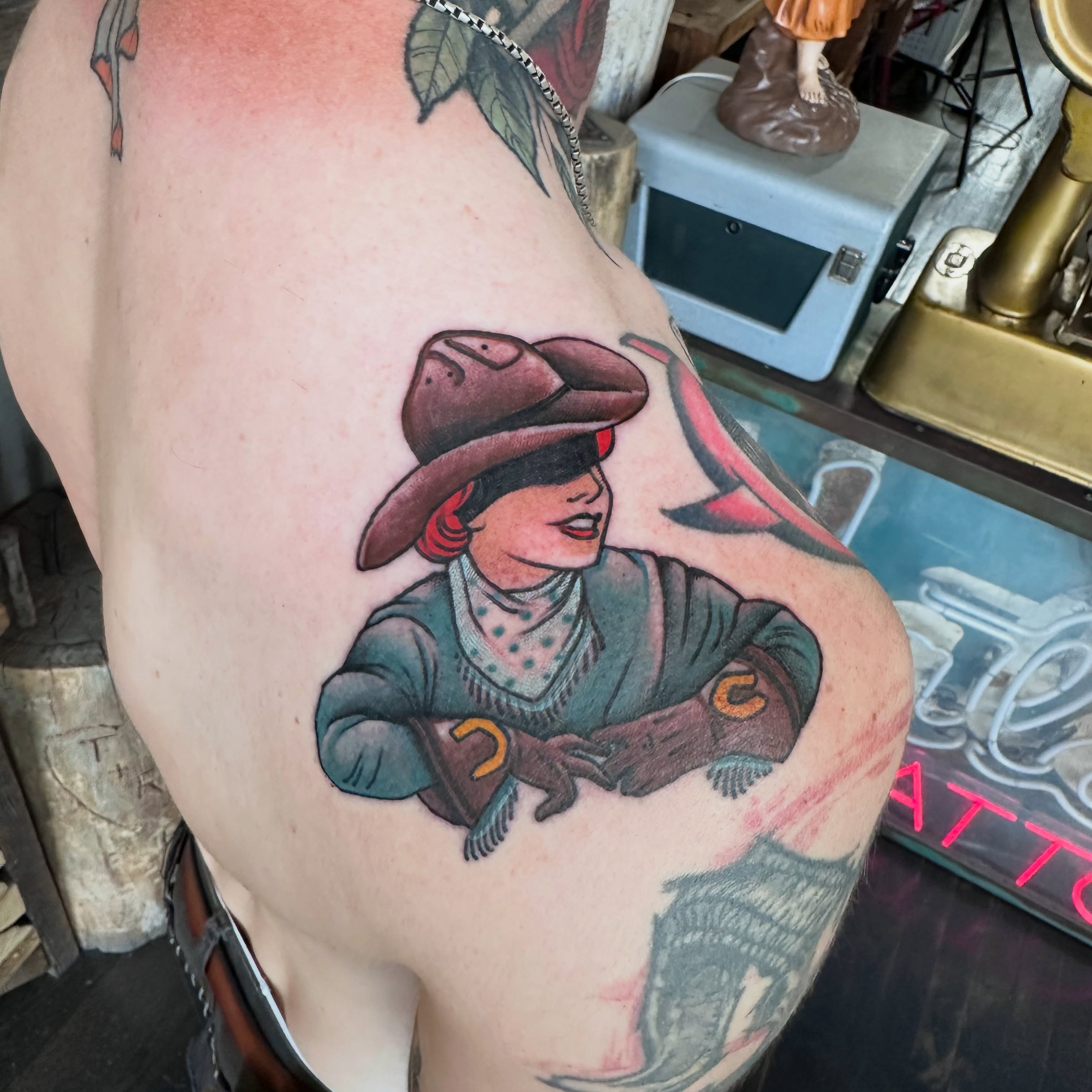 Cowgirl American traditional tattoo on the thigh by Noel Martinez, Golden, Colorado
