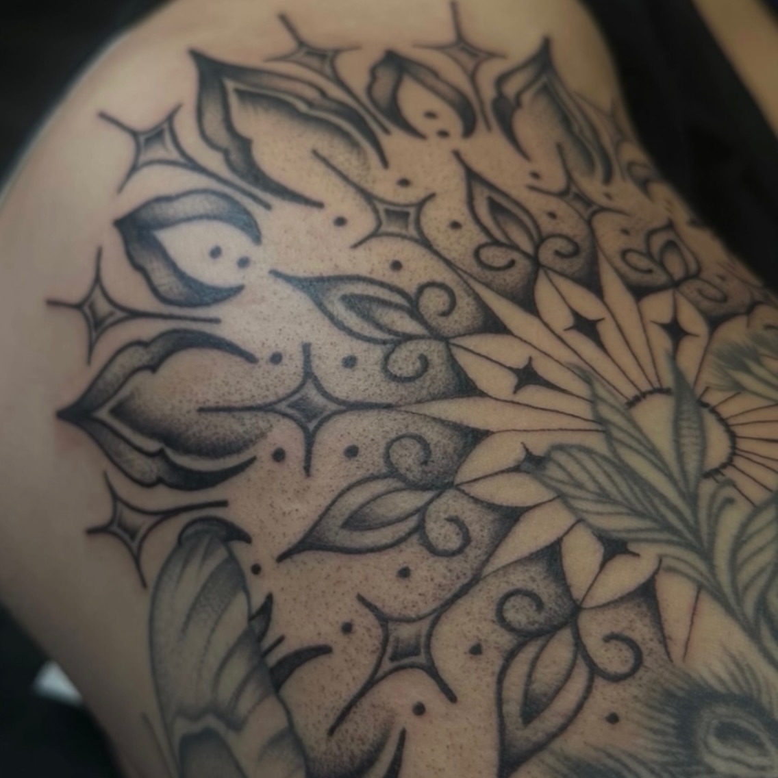 Floral pattern dotwork tattoo on the thigh by Ciera Farni, Murray, Utah