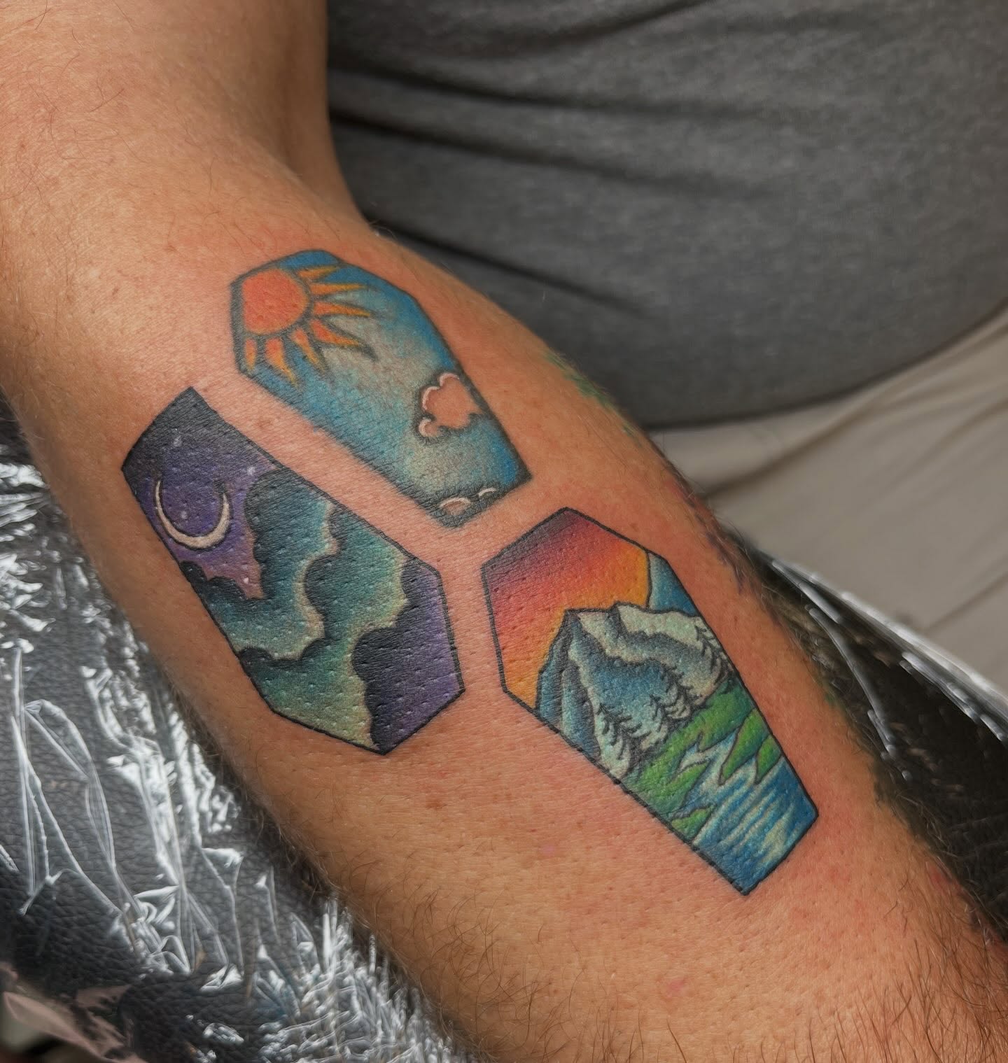 Geometric landscape geometric tattoo on the forearm by Ash Wheeler
