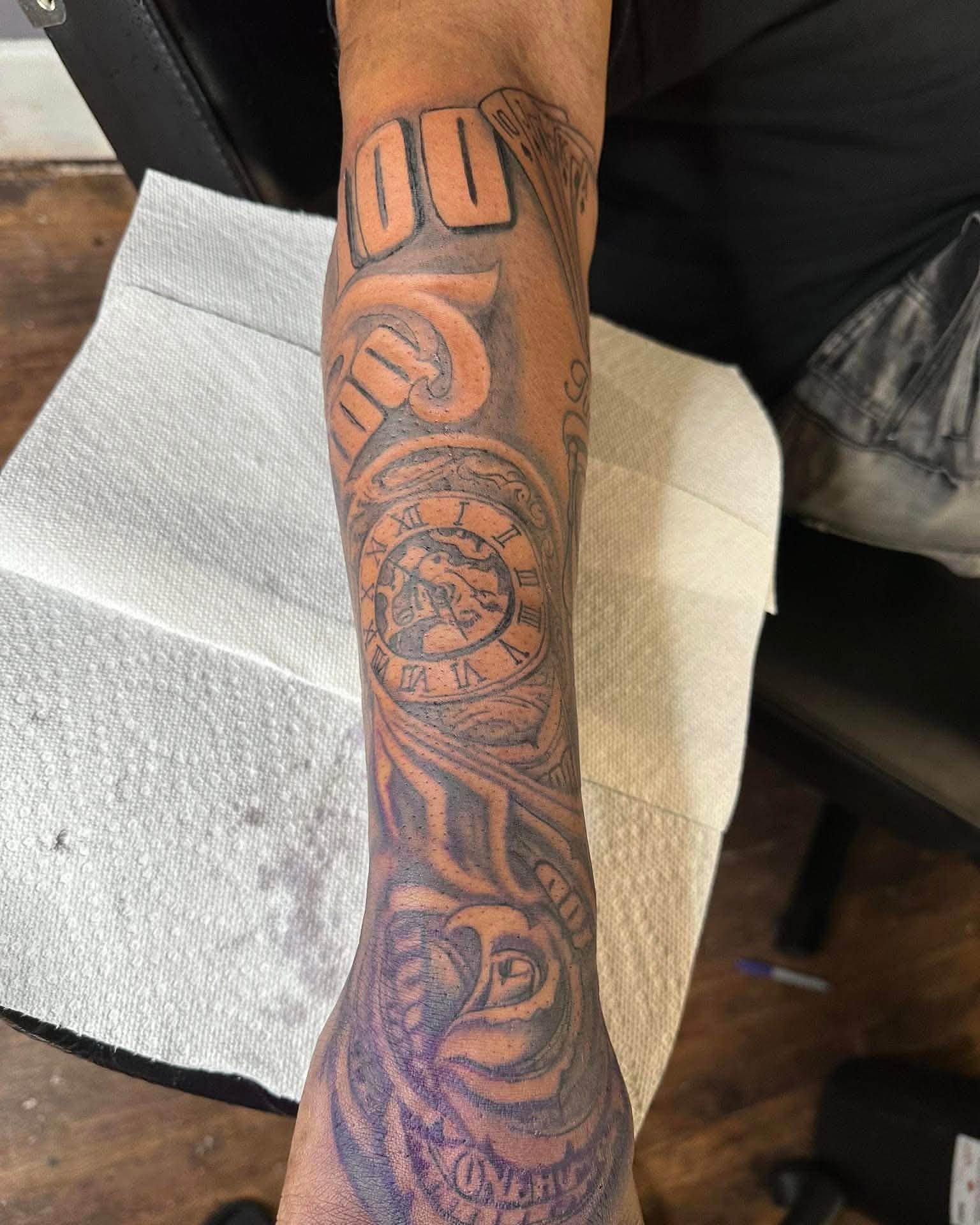Clock and rose black and grey tattoo on the forearm by Don Juan Ink Therapy, Jamesburg, New Jersey