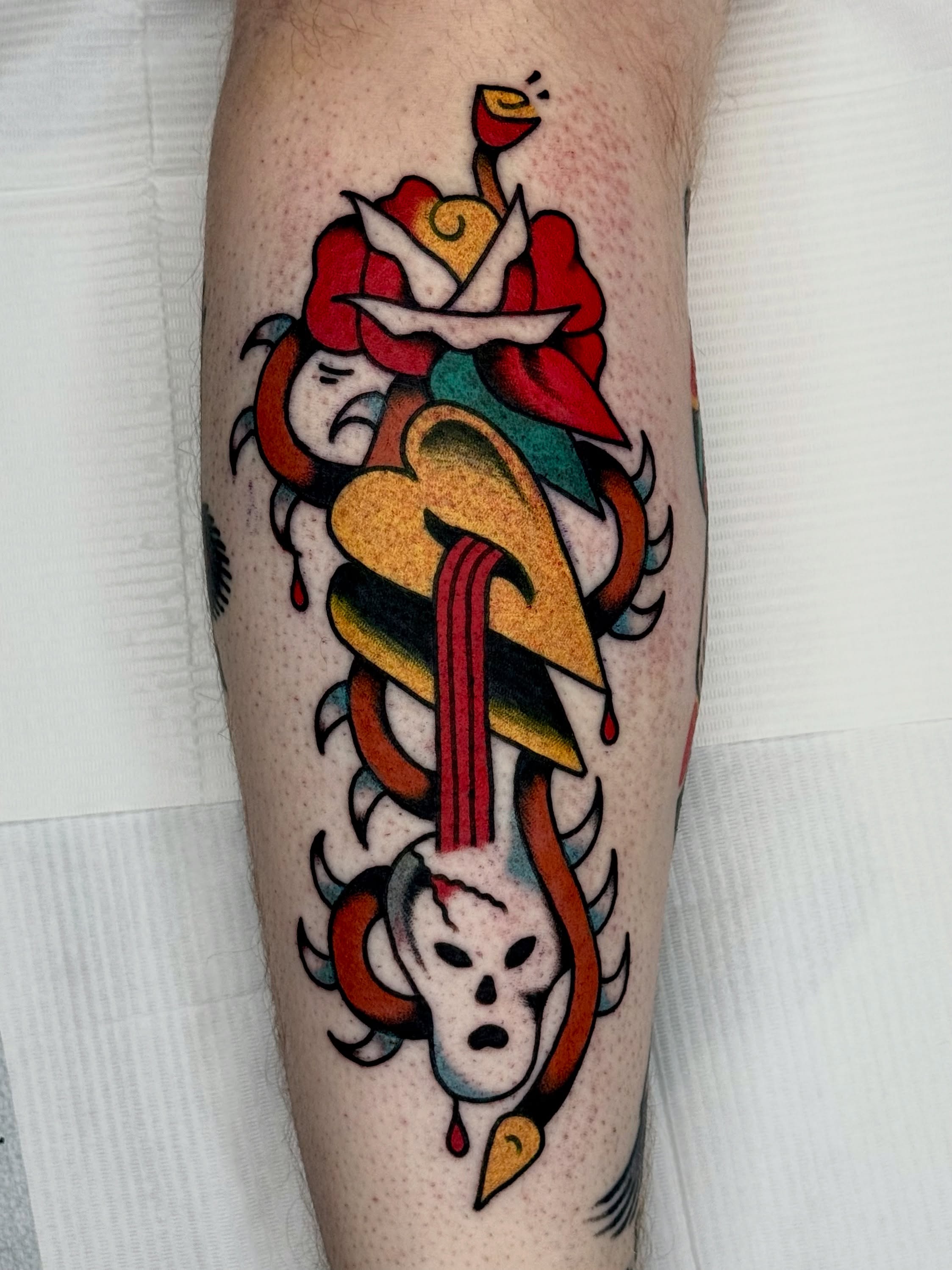 Rose and skull American traditional tattoo on the forearm by Roman