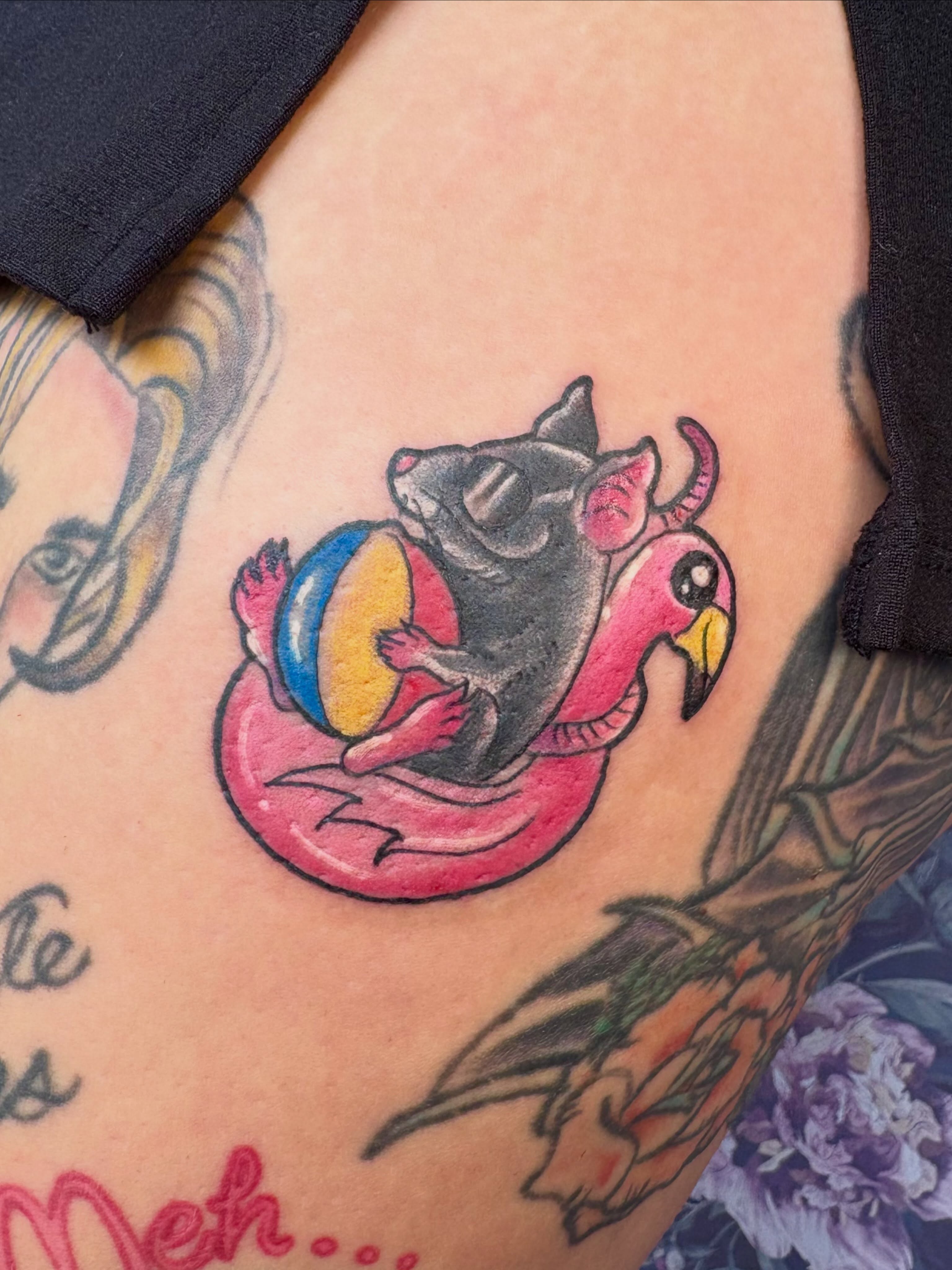 Mouse on flamingo float new school tattoo on the thigh by Bre Alex