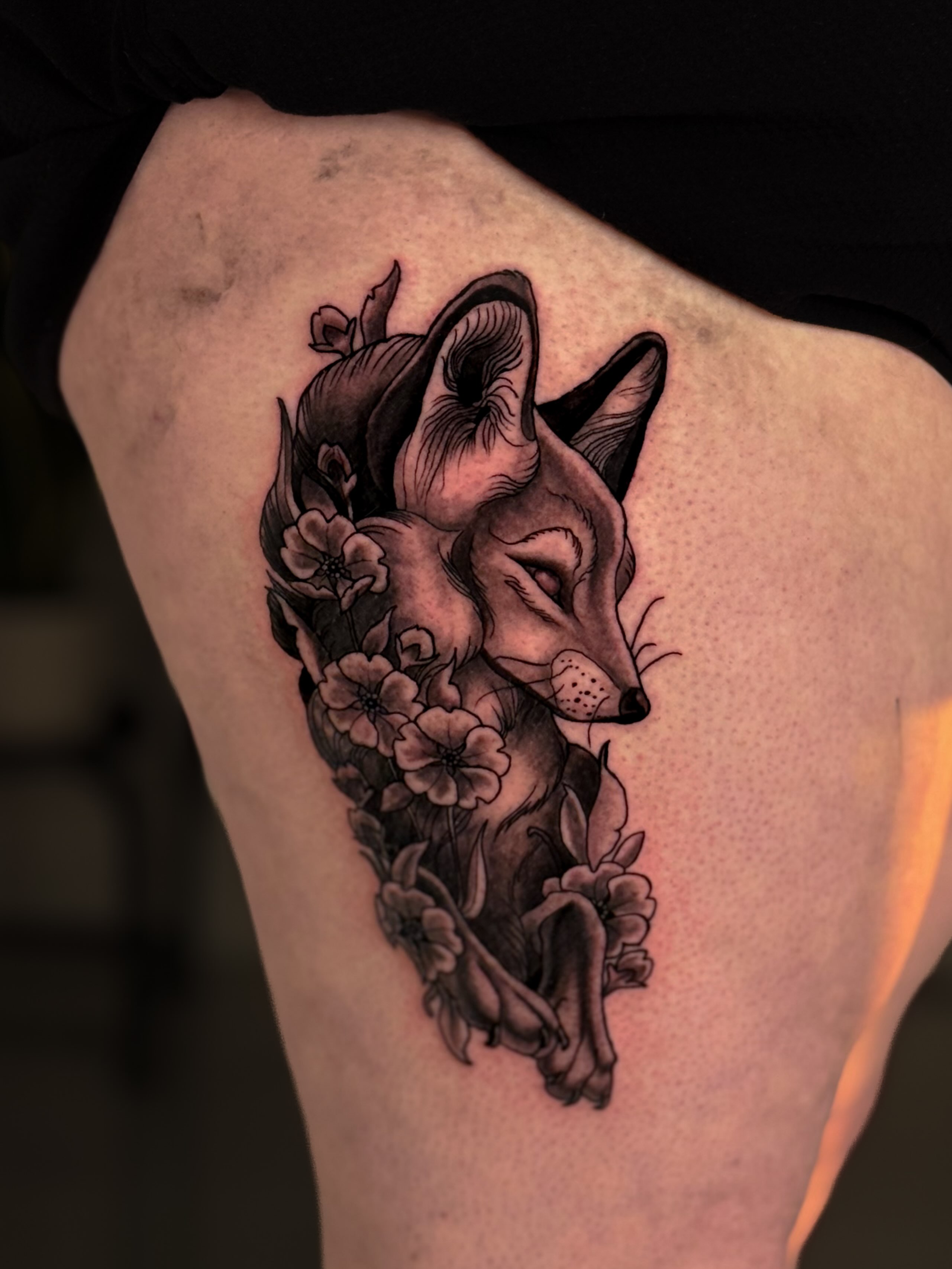 Fox and flowers realism tattoo on the thigh by Kai, Charlotte, North Carolina