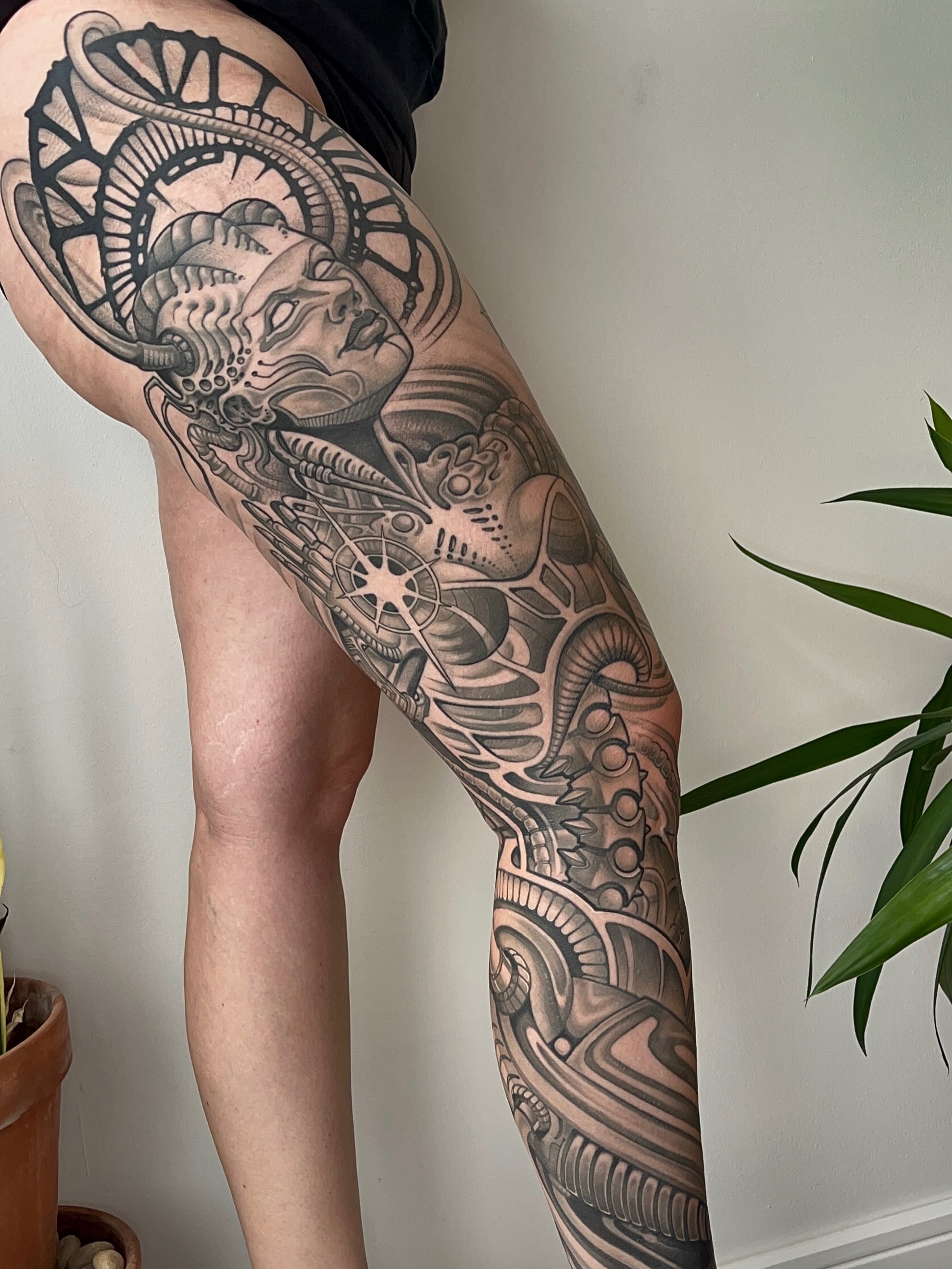 Mechanical skull geometric tattoo on the thigh by Samantha Castrovinci, Durham, North Carolina