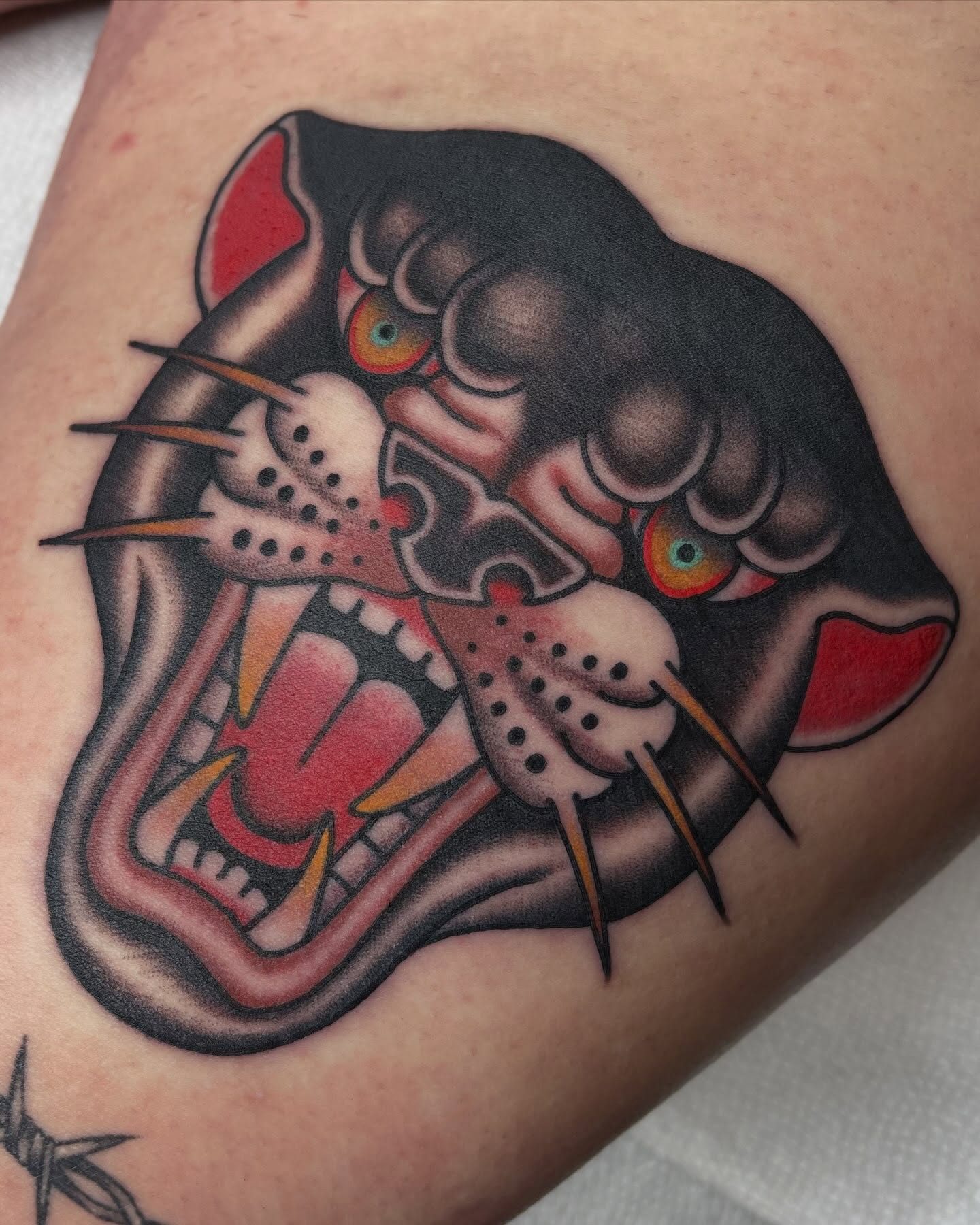 Panther American traditional tattoo on the thigh by Kyle Logan Frary
