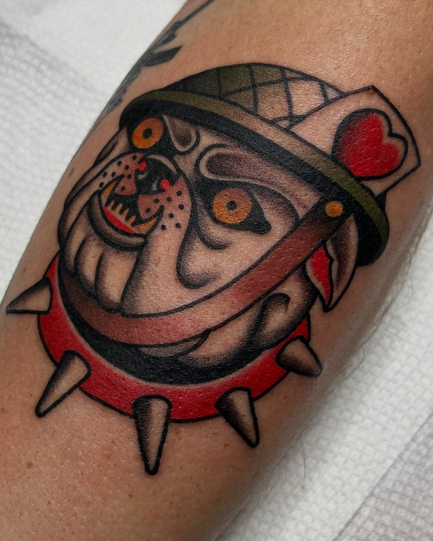Joker mask American traditional tattoo on the forearm by Kyle Logan Frary