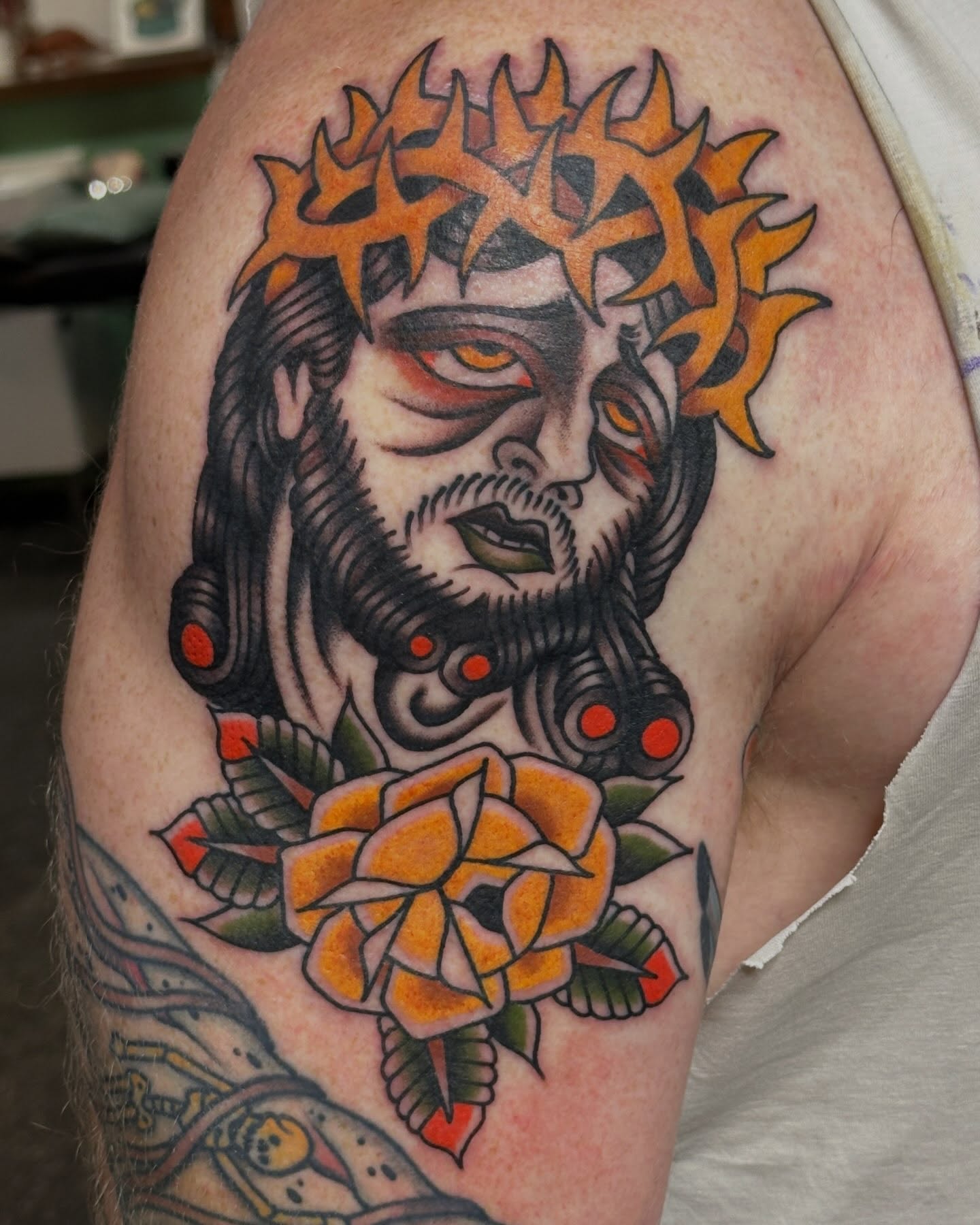 Jesus Christ American traditional tattoo on the shoulder by Kyle Logan Frary