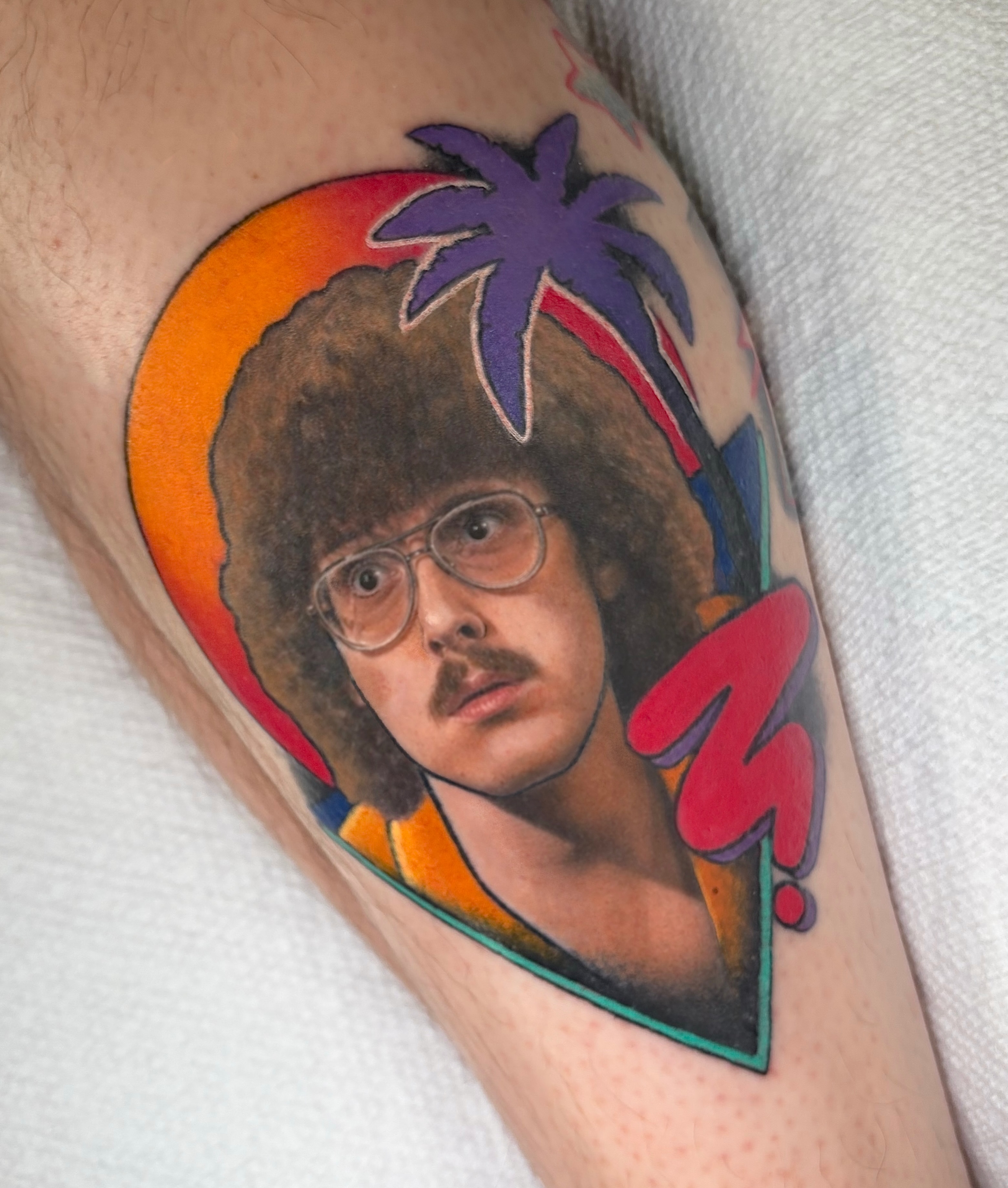 Person with afro and glasses realism tattoo on the forearm by ππππππ